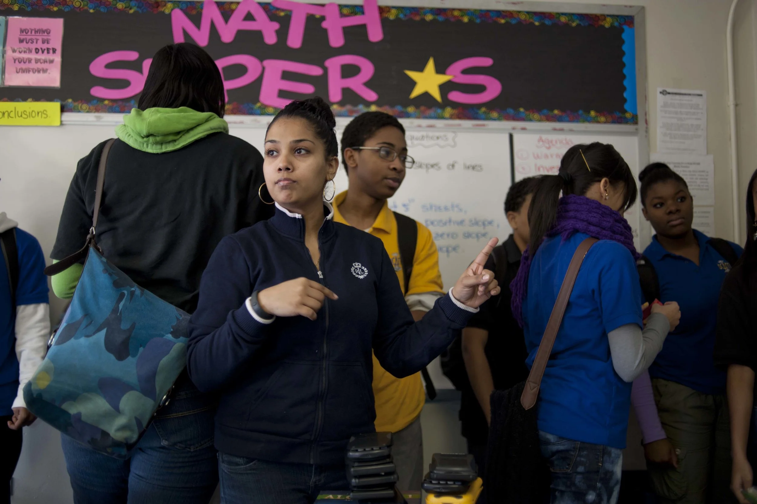 Ms. Bujan tries to gain control of her class as the dismissal bell rings. 