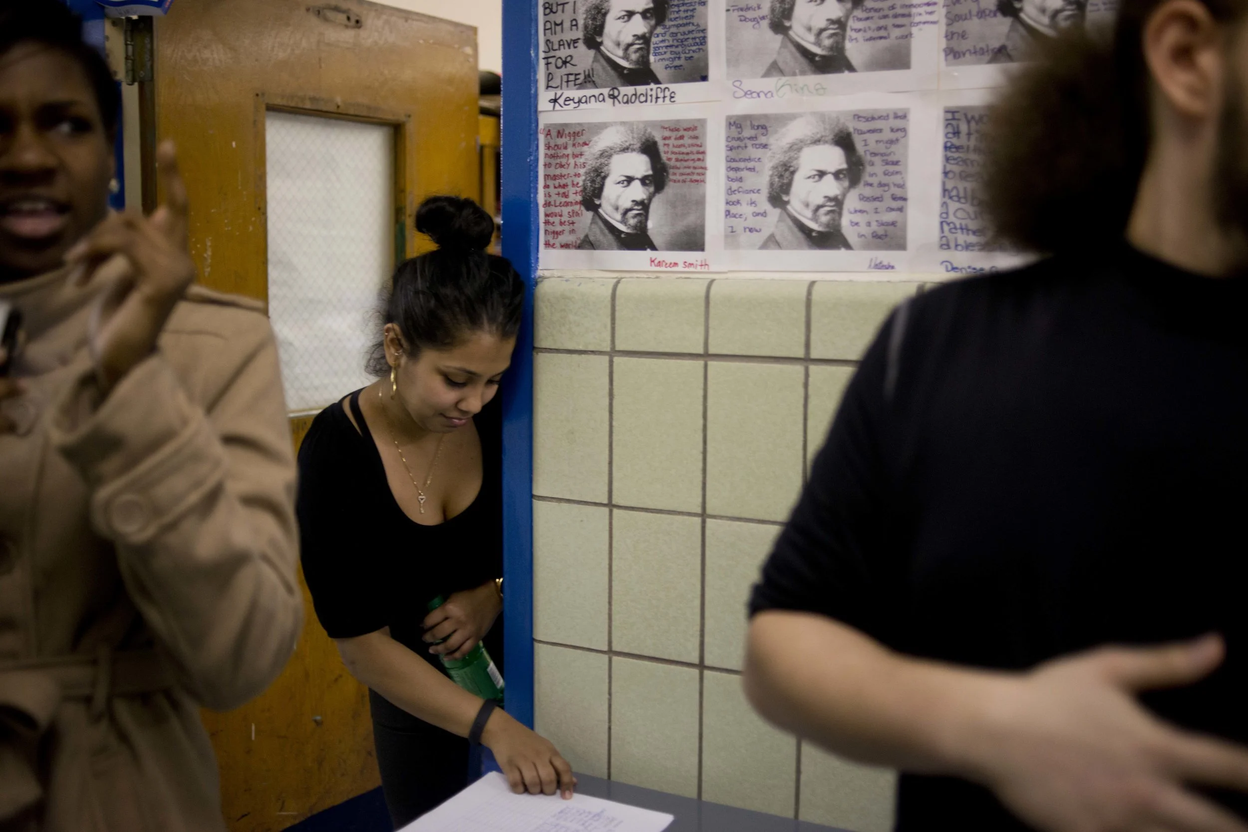 Ms. Bujan checks the sign-in list for parent-teacher conferences. Fewer than half of her students' parents or guardians showed up.
