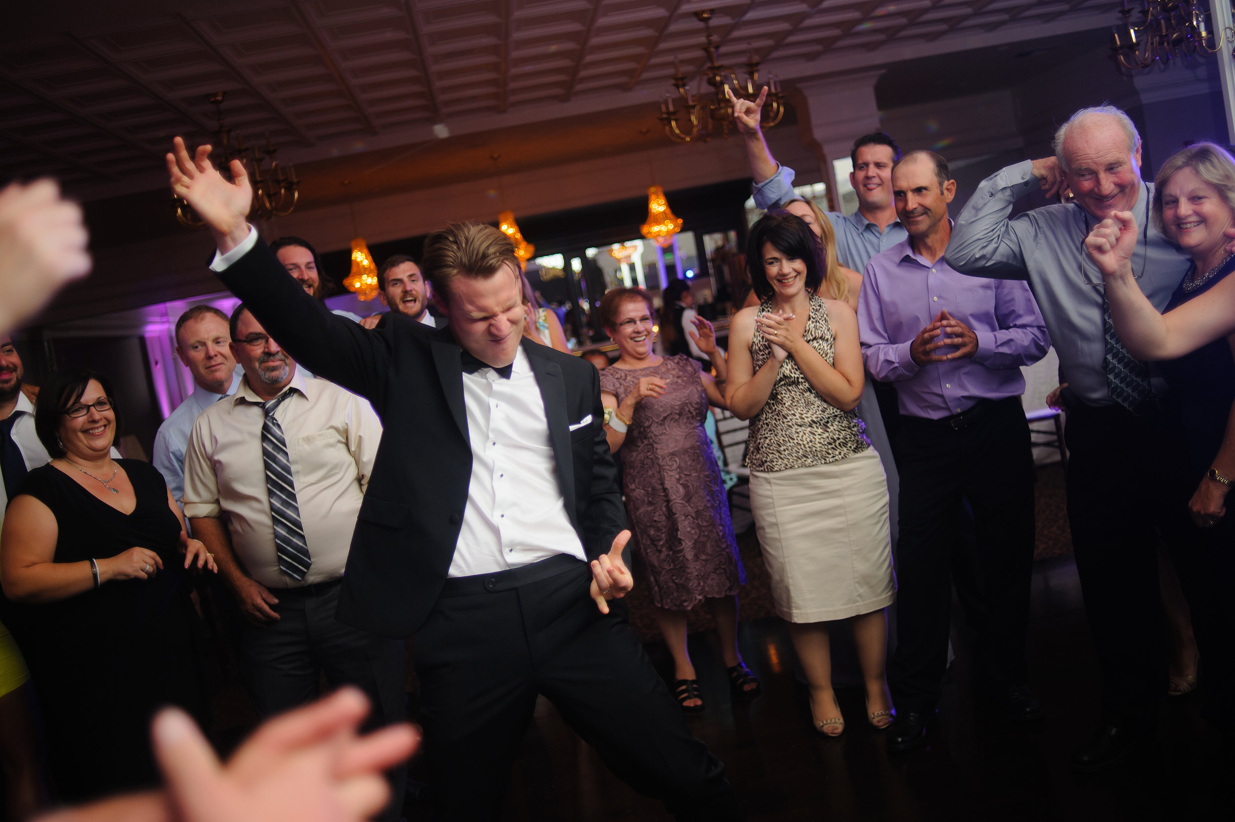  Groom dancing at reception during wedding at Arden Hills Club and Spa in Sacramento California. 
