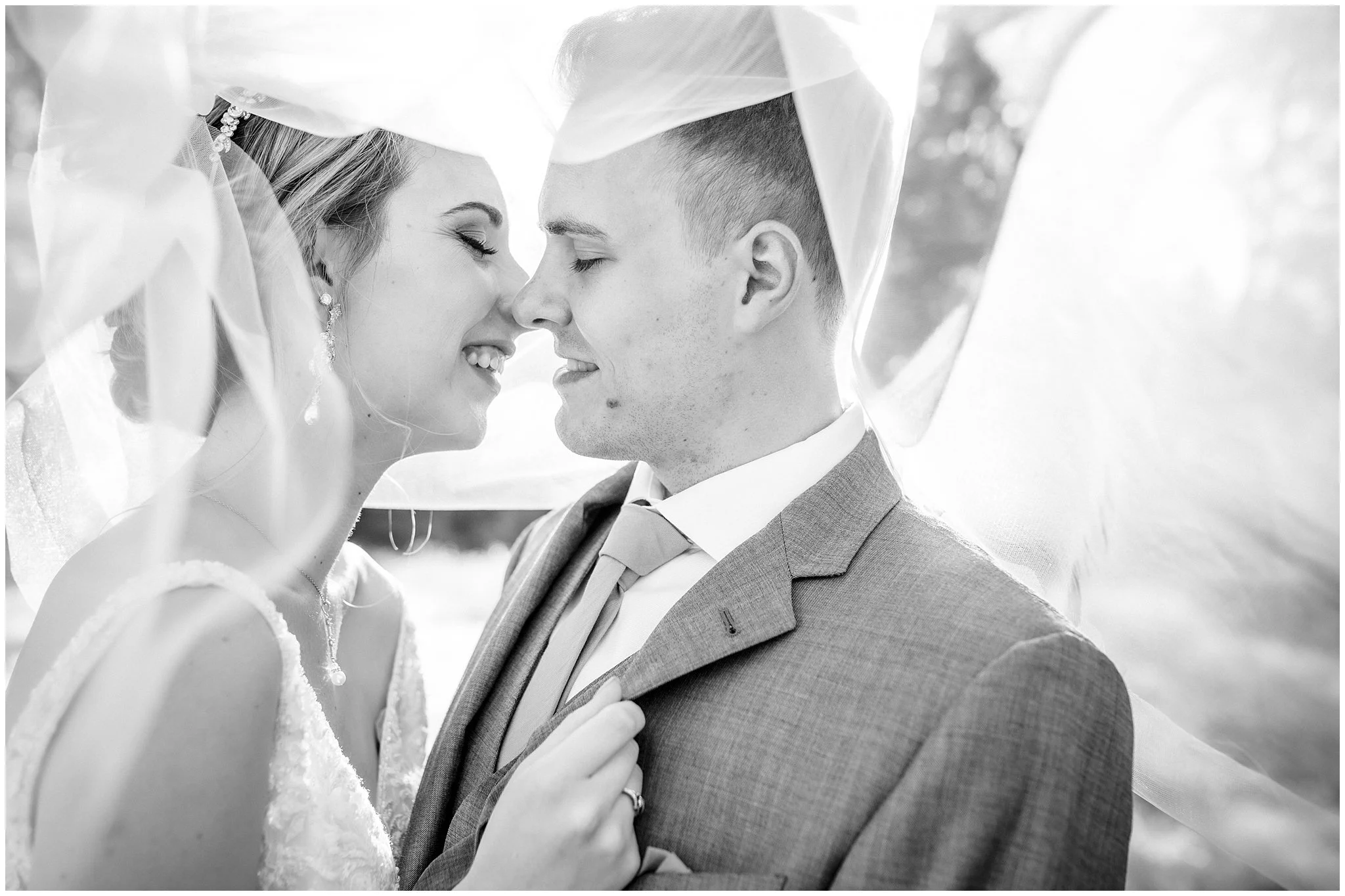 Spring wedding at Monte Verde Inn, bride and groom under veil