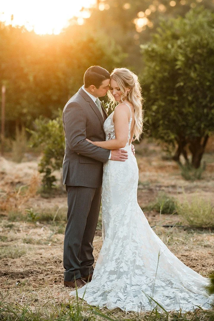 Sunset portrait of bride and groom at their Flower Farm wedding in Loomis, CA