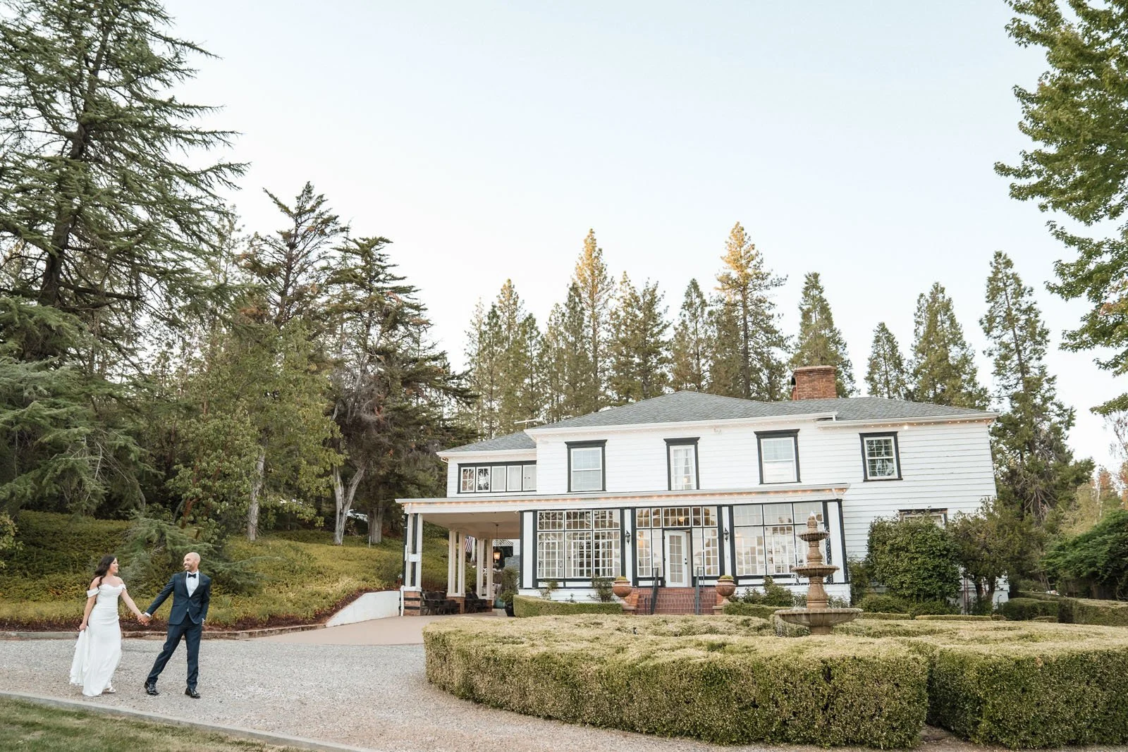 Bride and groom walking hand in hand at their Monte Verde Inn wedding
