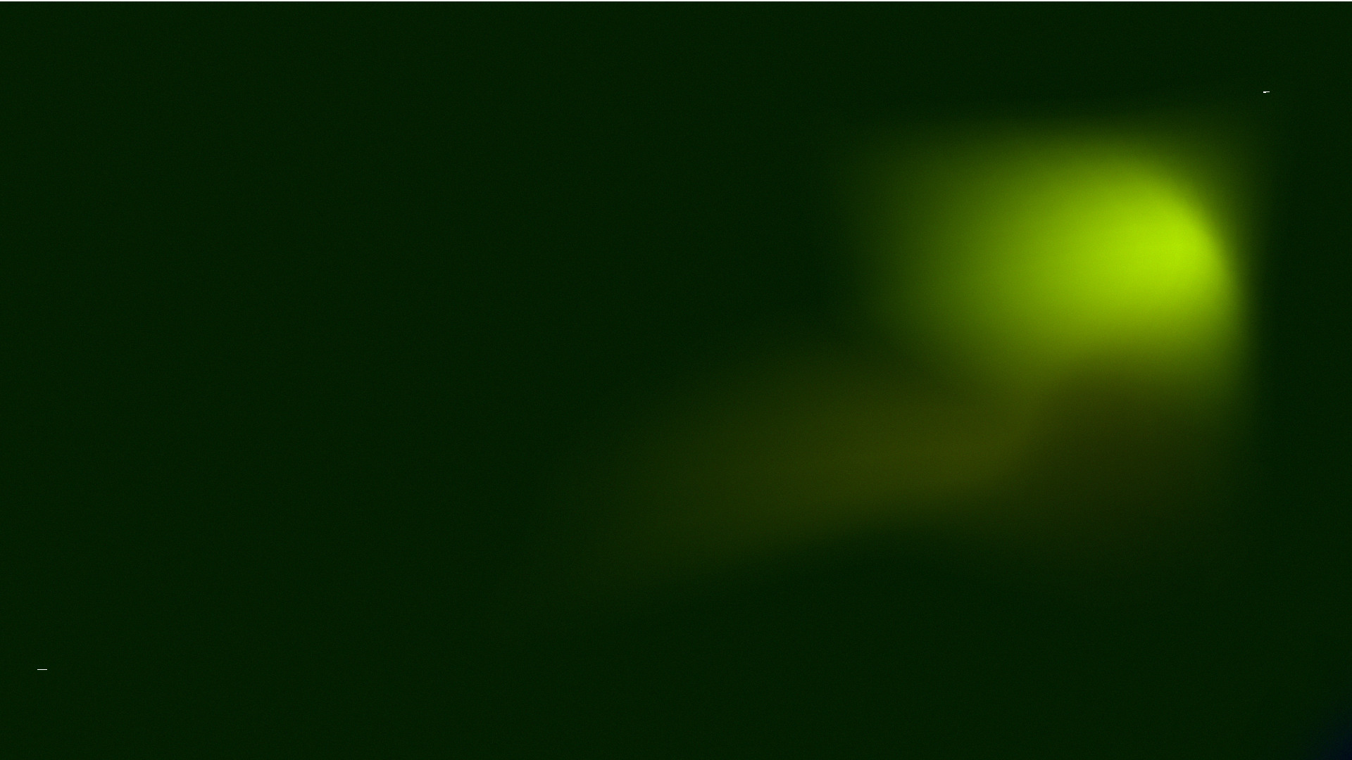 An abstract blurred image with shades of green and yellow.
