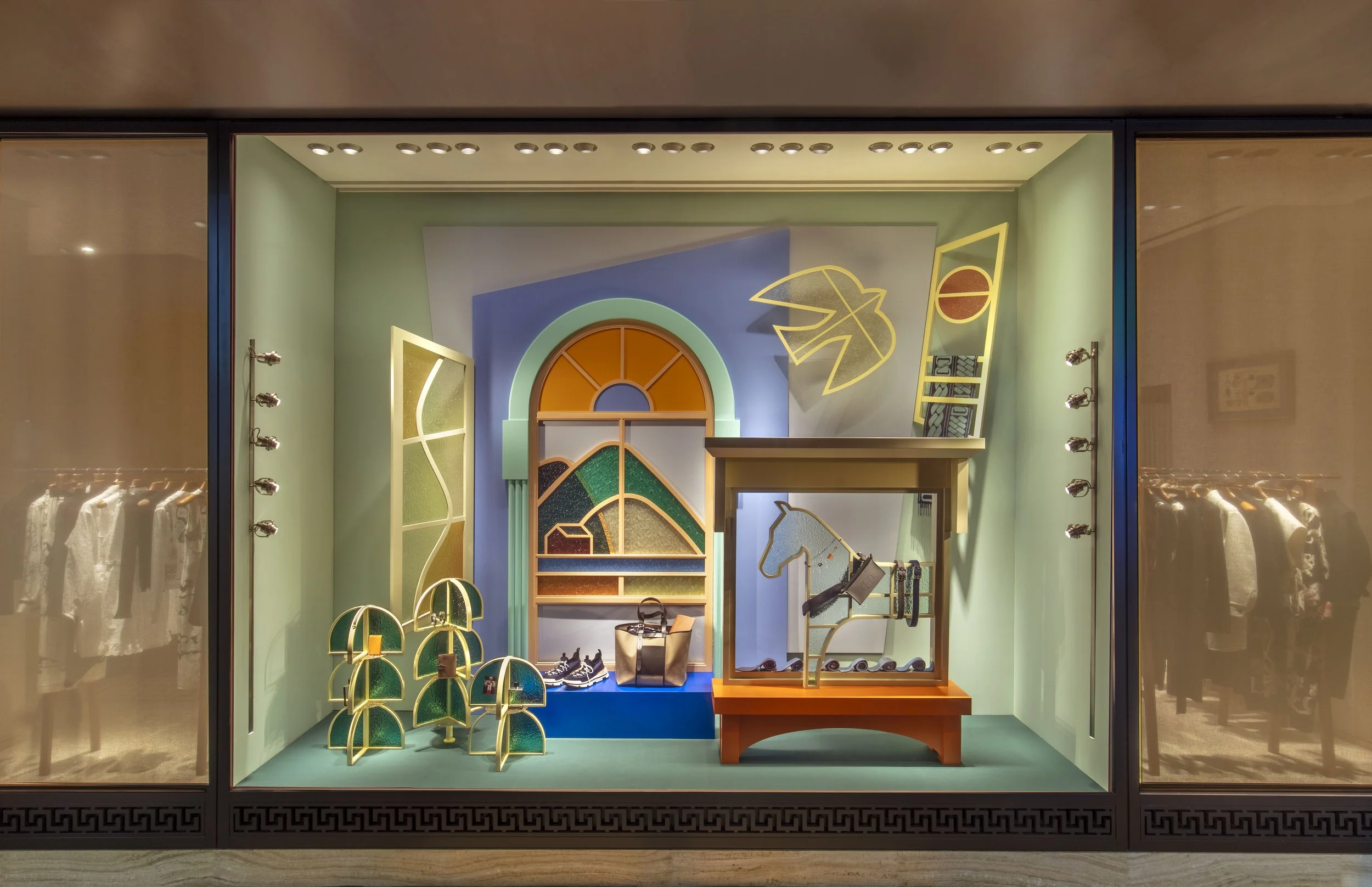 "Venture Beyond: Frames of Fantasy," a luxury Hermès window display installation by Cynthia Mak reimagining doors, windows, and gates.