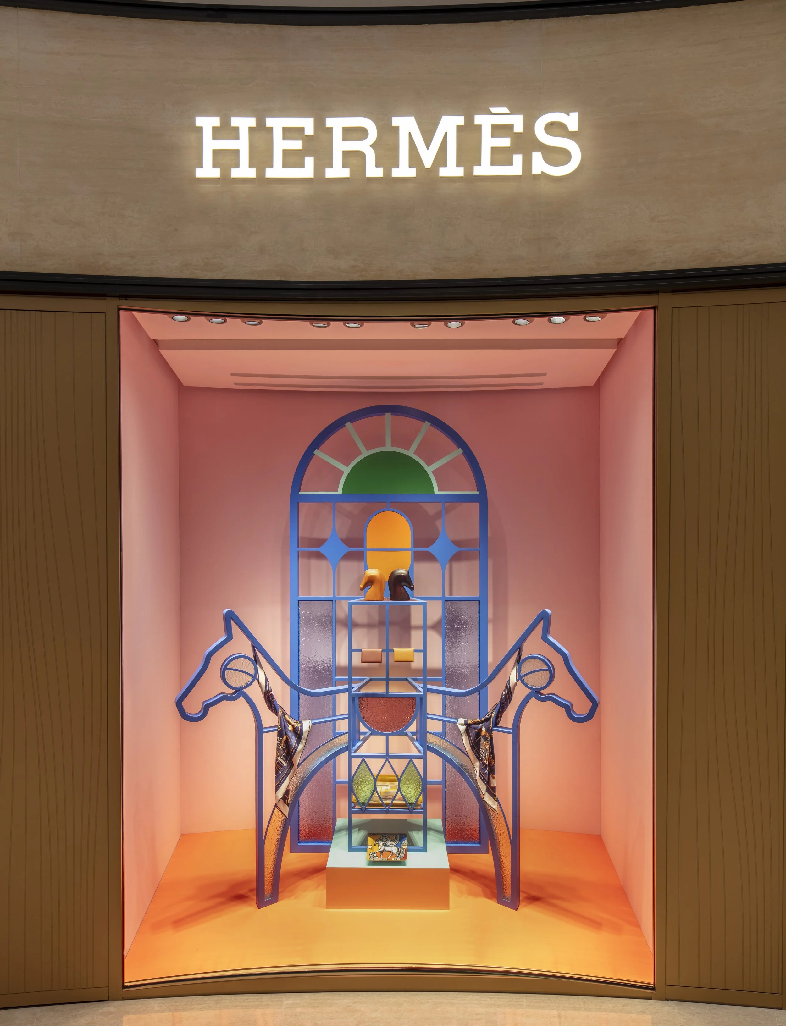 "Venture Beyond: Frames of Fantasy," a luxury Hermès window display installation by Cynthia Mak reimagining doors, windows, and gates.