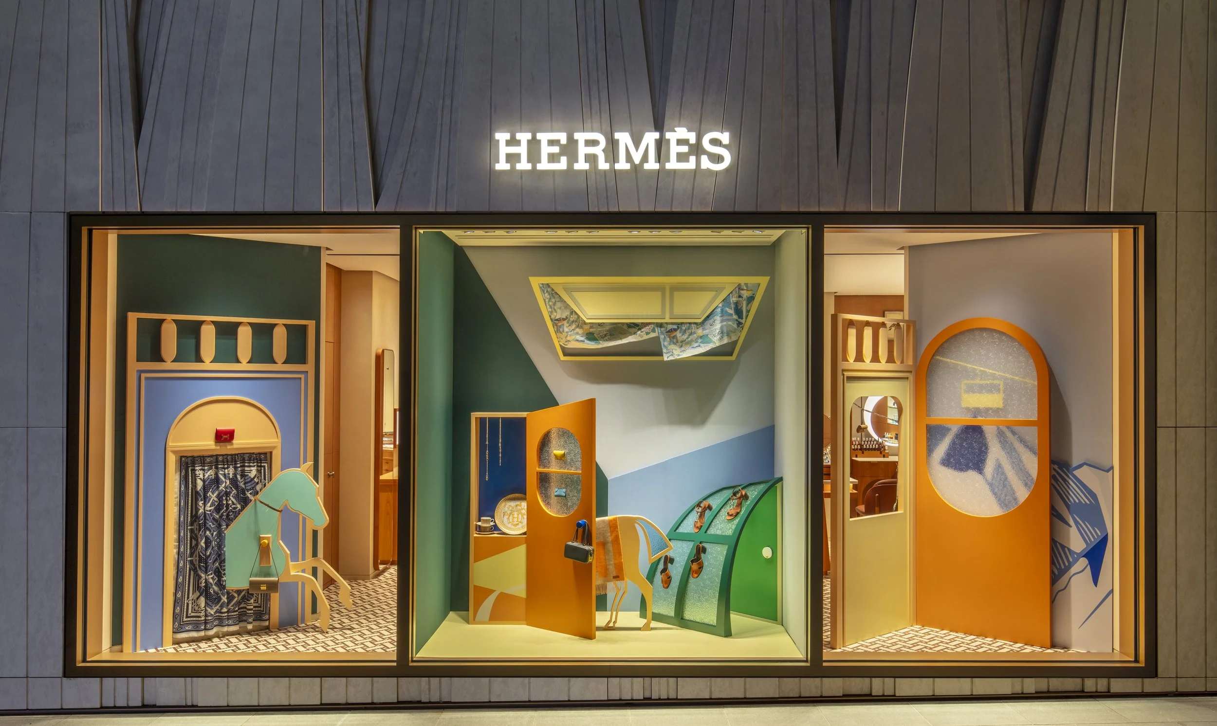 "Venture Beyond: Frames of Fantasy," a luxury Hermès window display installation by Cynthia Mak reimagining doors, windows, and gates.