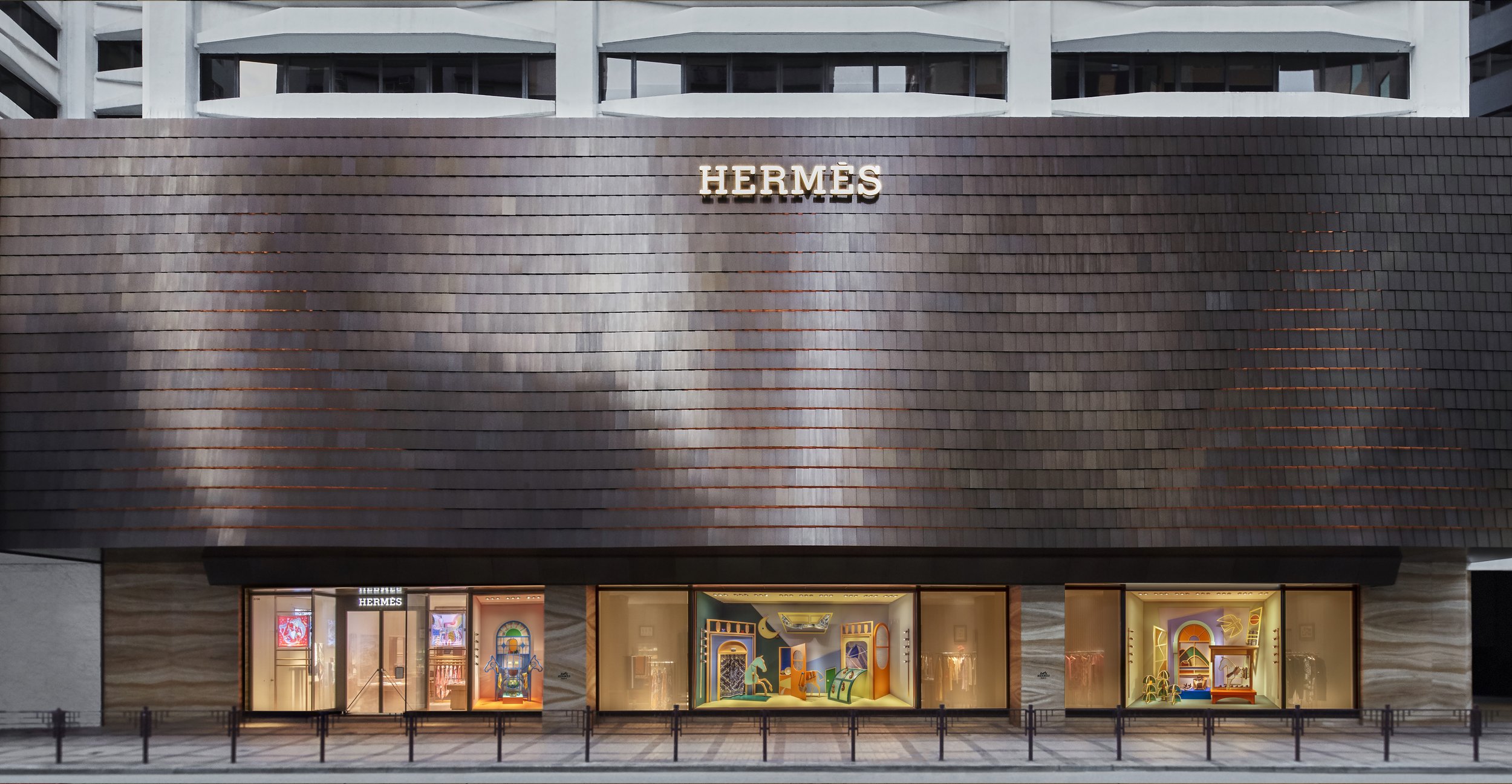 "Venture Beyond: Frames of Fantasy," a luxury Hermès window display installation by Cynthia Mak reimagining doors, windows, and gates.