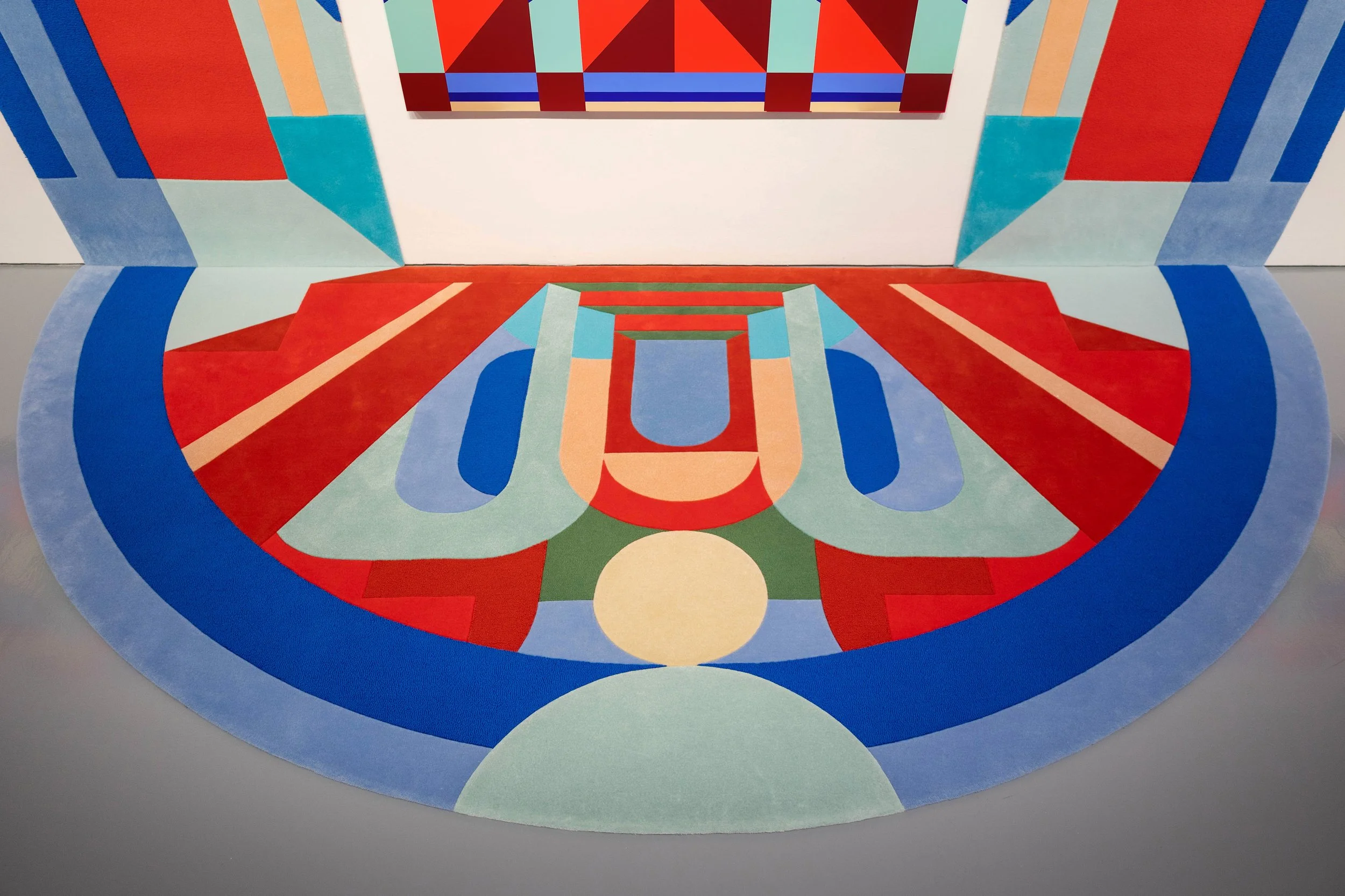 Detail view of "The Façade" by Cynthia Mak, from her solo exhibition "The Architecture of Joy." This monumental multi-panel painting installation features a bespoke collaborative carpet crafted by Hong Kong atelier Tai Ping.