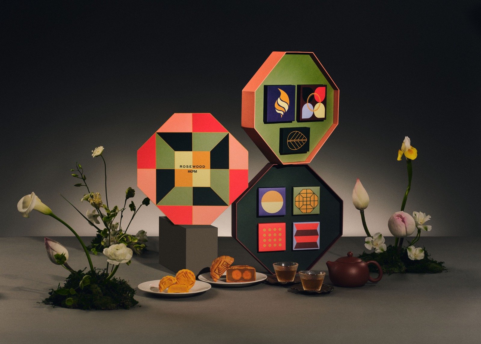 The Seric Lantern hanging mooncake packaging design by Cynthia Mak for Rosewood Hong Kong x Palace Museum collaboration, featuring a red Palace Museum-inspired roof, an octagonal geometric body, black tassel, and a full moon background with flowers.