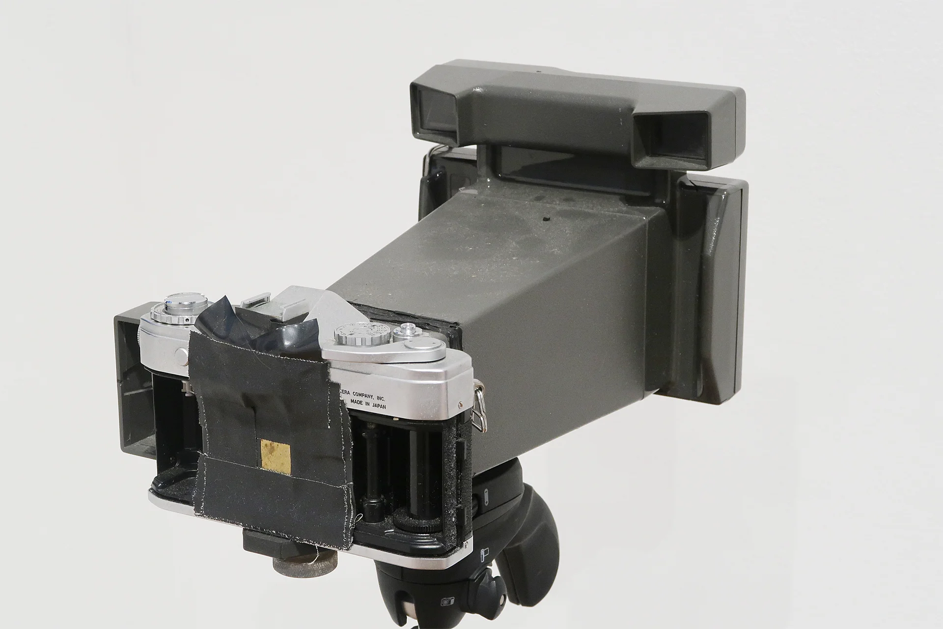Young’s Camera: Modified Polaroid Big Shot camera used for Waves. Salvaged Polaroid Big Shot camera and Canon SLR body, salvaged pinhole and double-slit slide. Last modification: 2017.