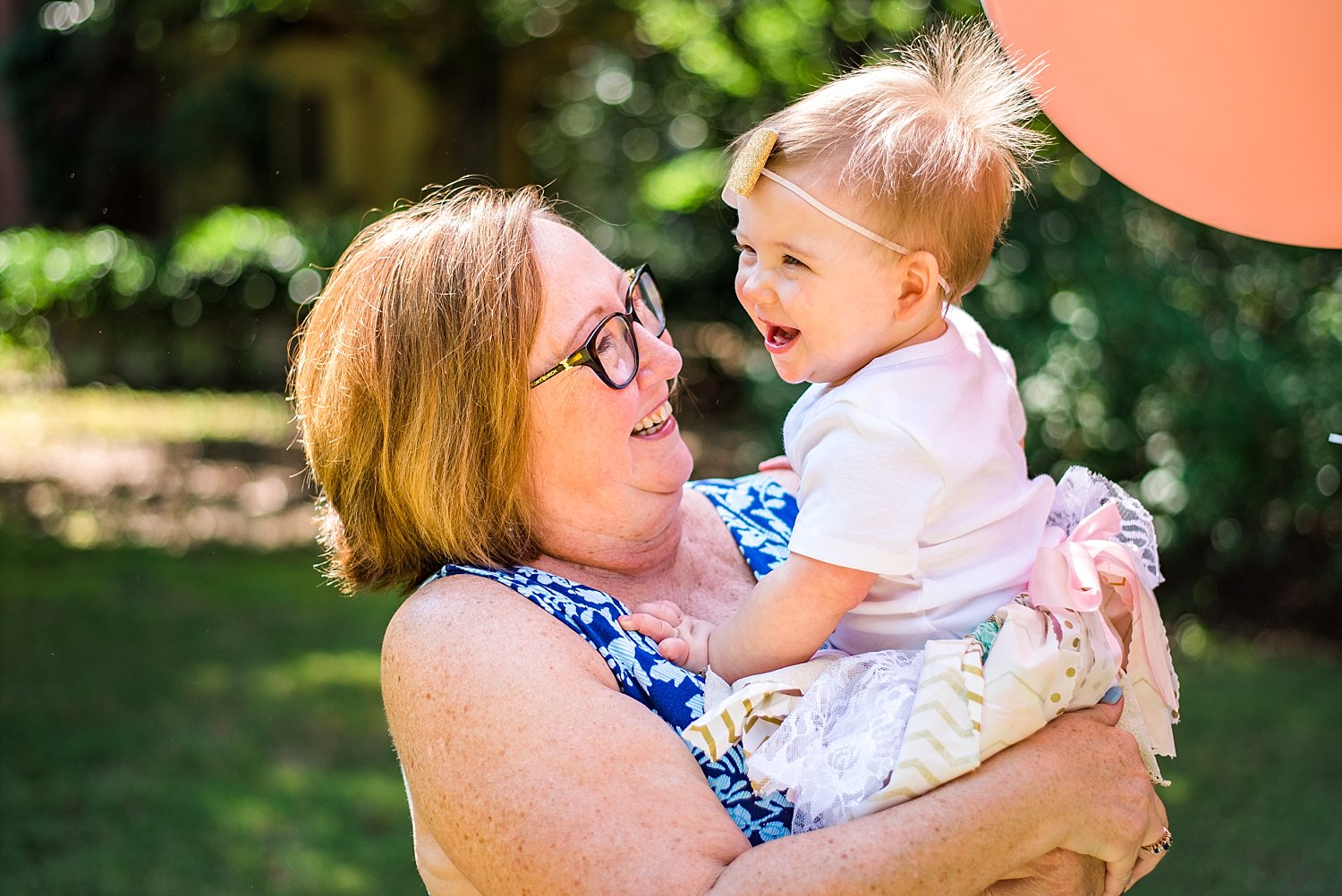 baby girl and grandma laughing