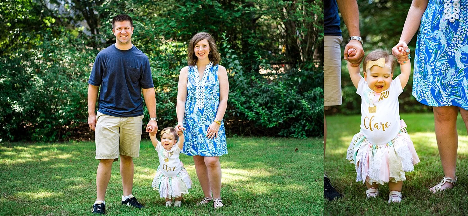 Baby girl and parents at first birthday