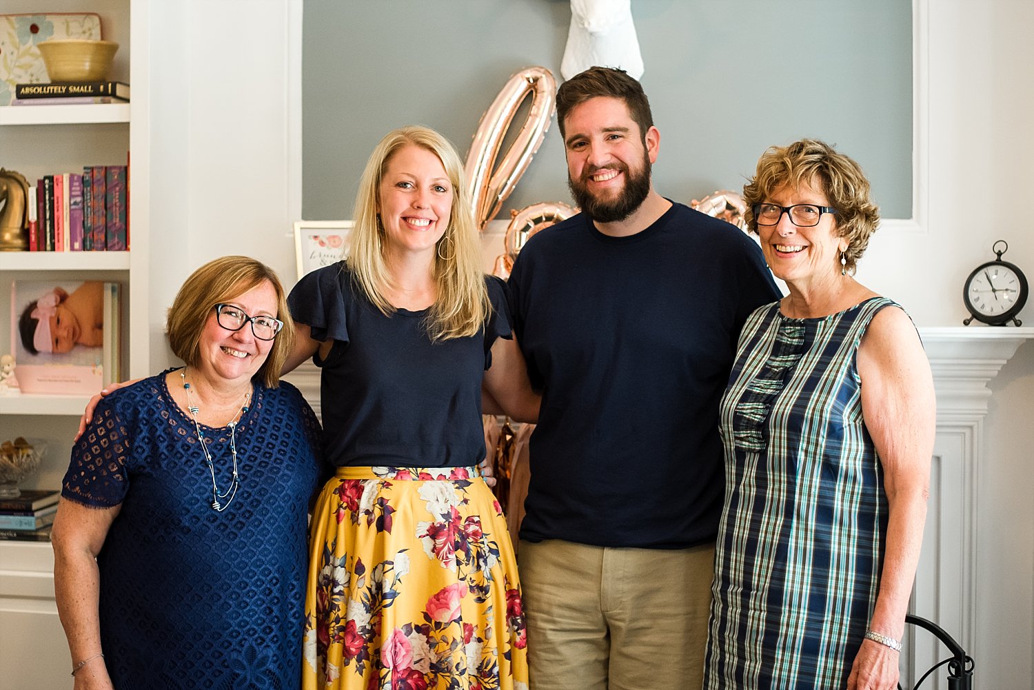 bride and groom with mothers at bridal shower