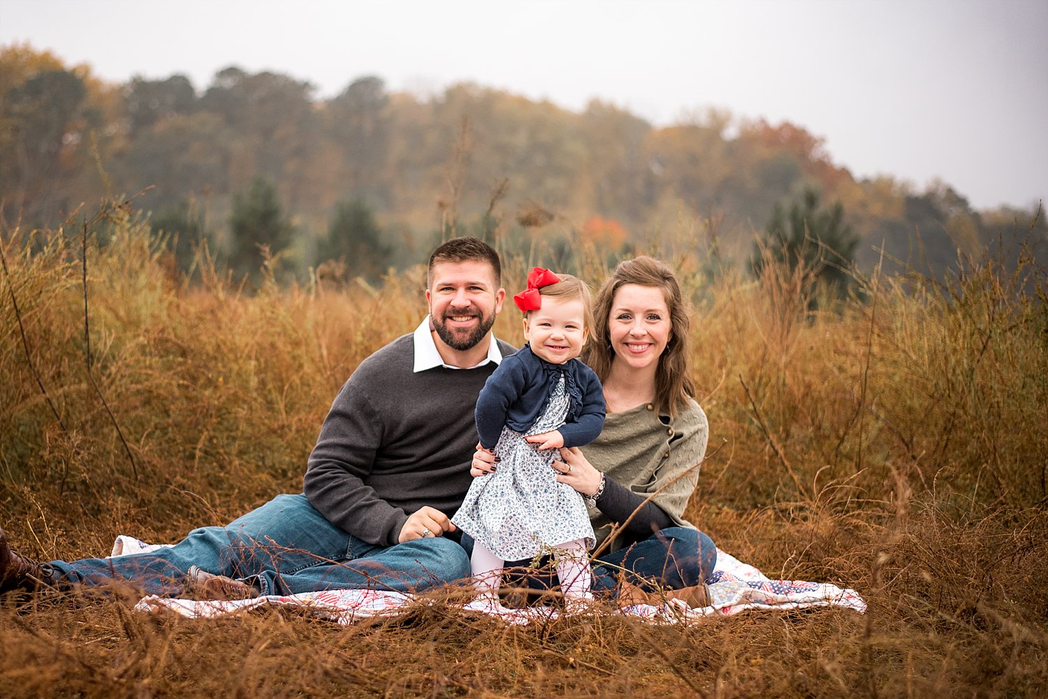 family of 3 in tallk grass at Garrard Landing Park, Roswell, GA