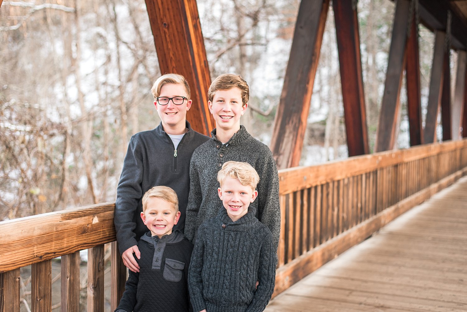 4 brothers on covered bridge in Roswell, GA