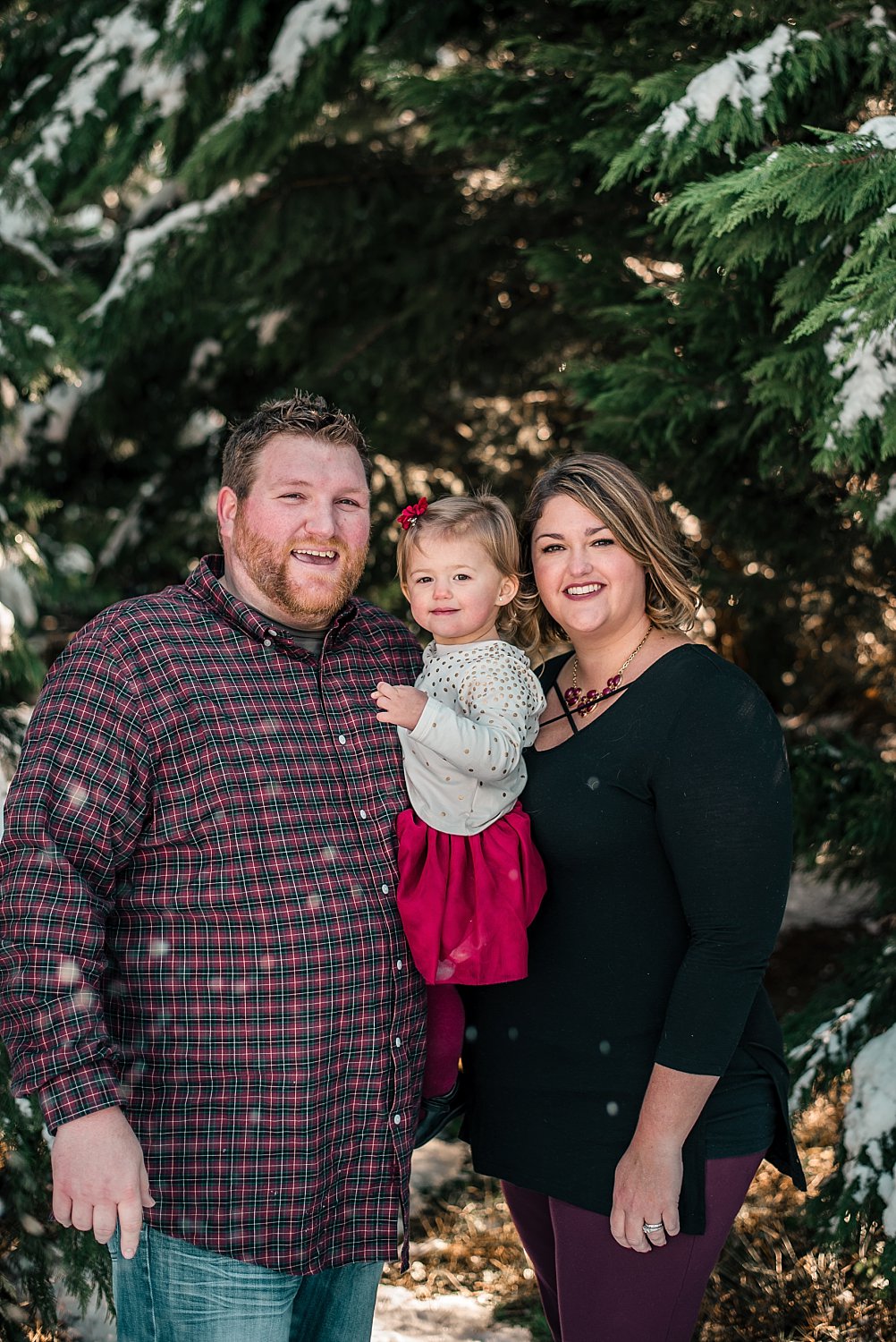 Family of 3 in snow at Barry Patch Farms, Woodstock
