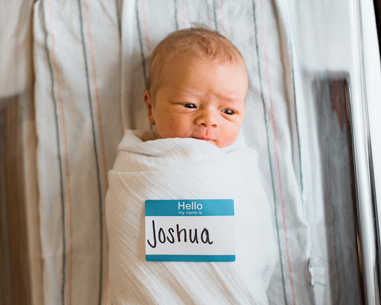 Baby swaddled in hospital bassinet at Cherokee Northside Hospital