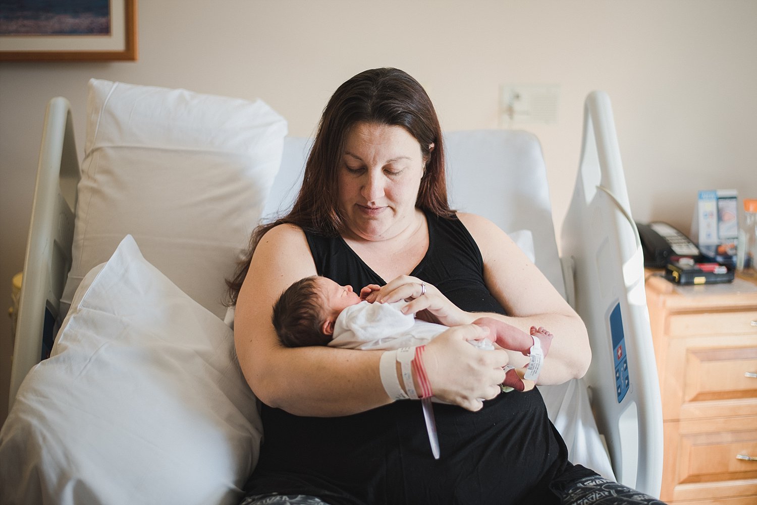 mom in hospital bed looking at baby at Northside Atlanta Hospital