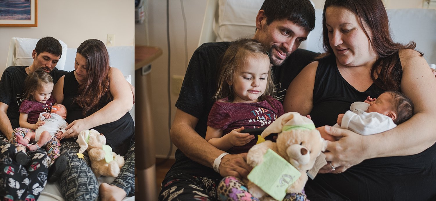 family sitting in hospital bed looking at newborn baby at Northside Atlanta Hospital