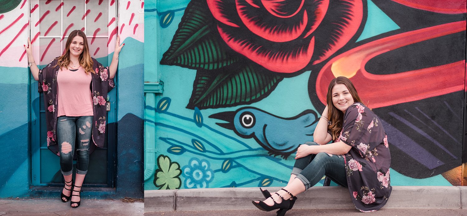 Senior girl in front of painted mural in city