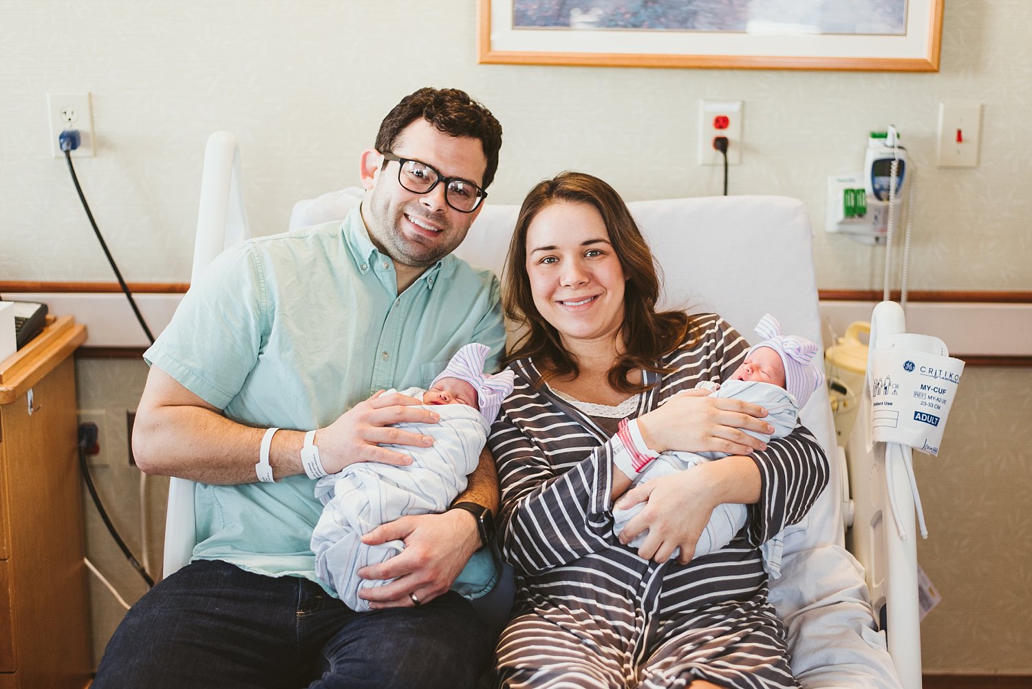 Parents smiling with newborn baby twins at Atlanta Northside Hospital