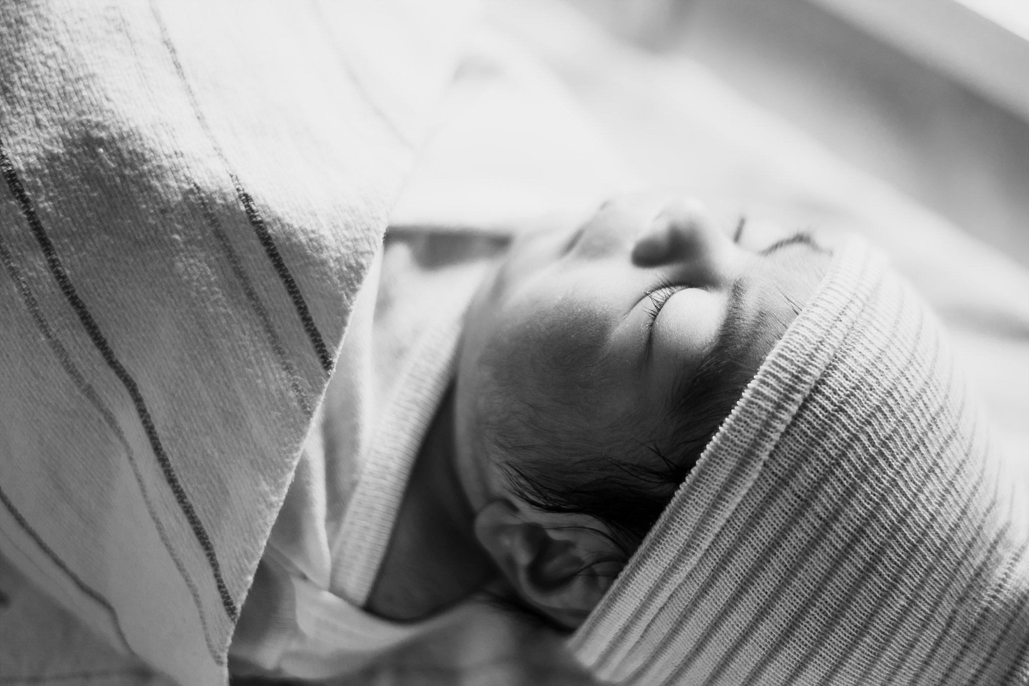 black & white profile of newborn baby boy