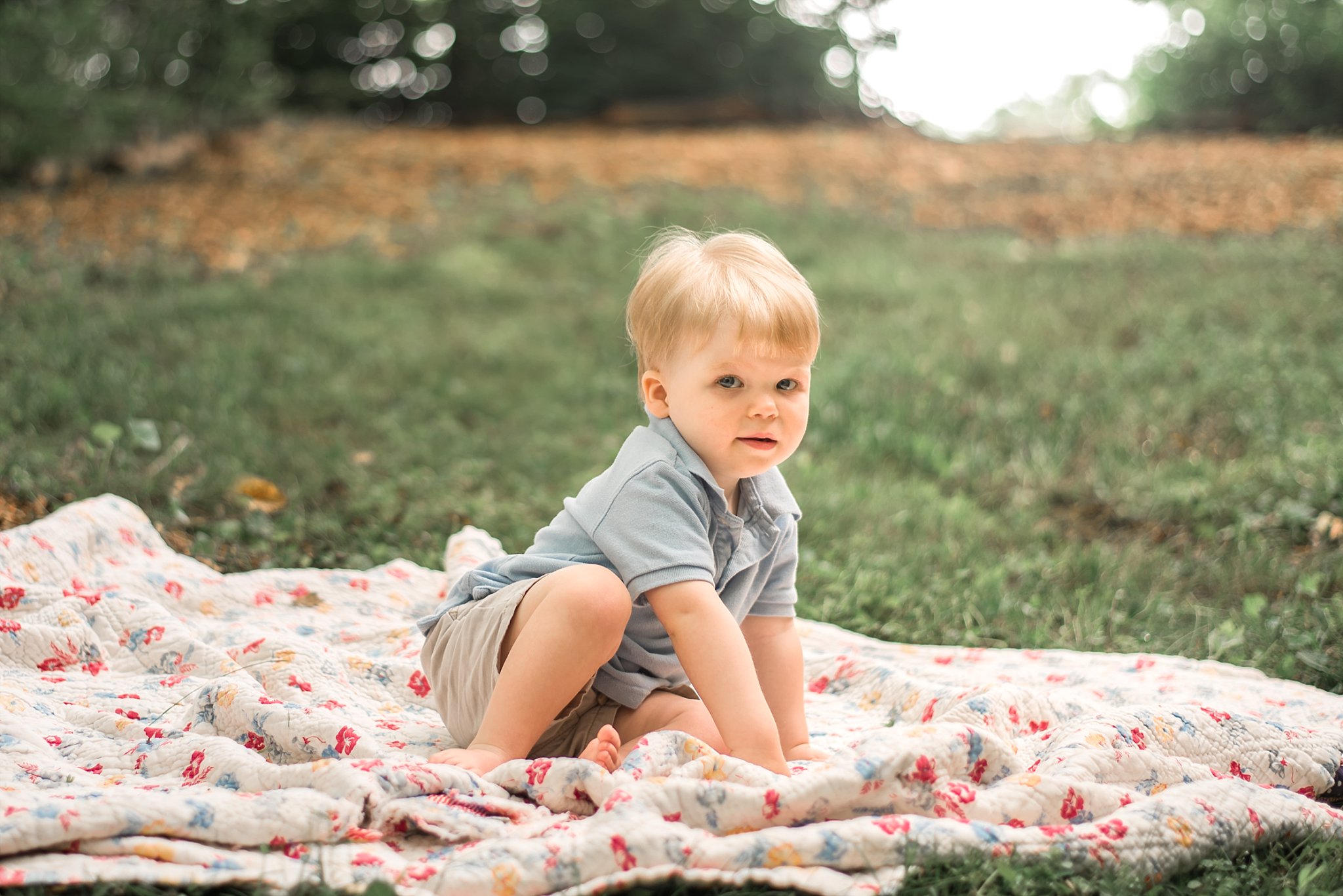 toddler boy on quilt