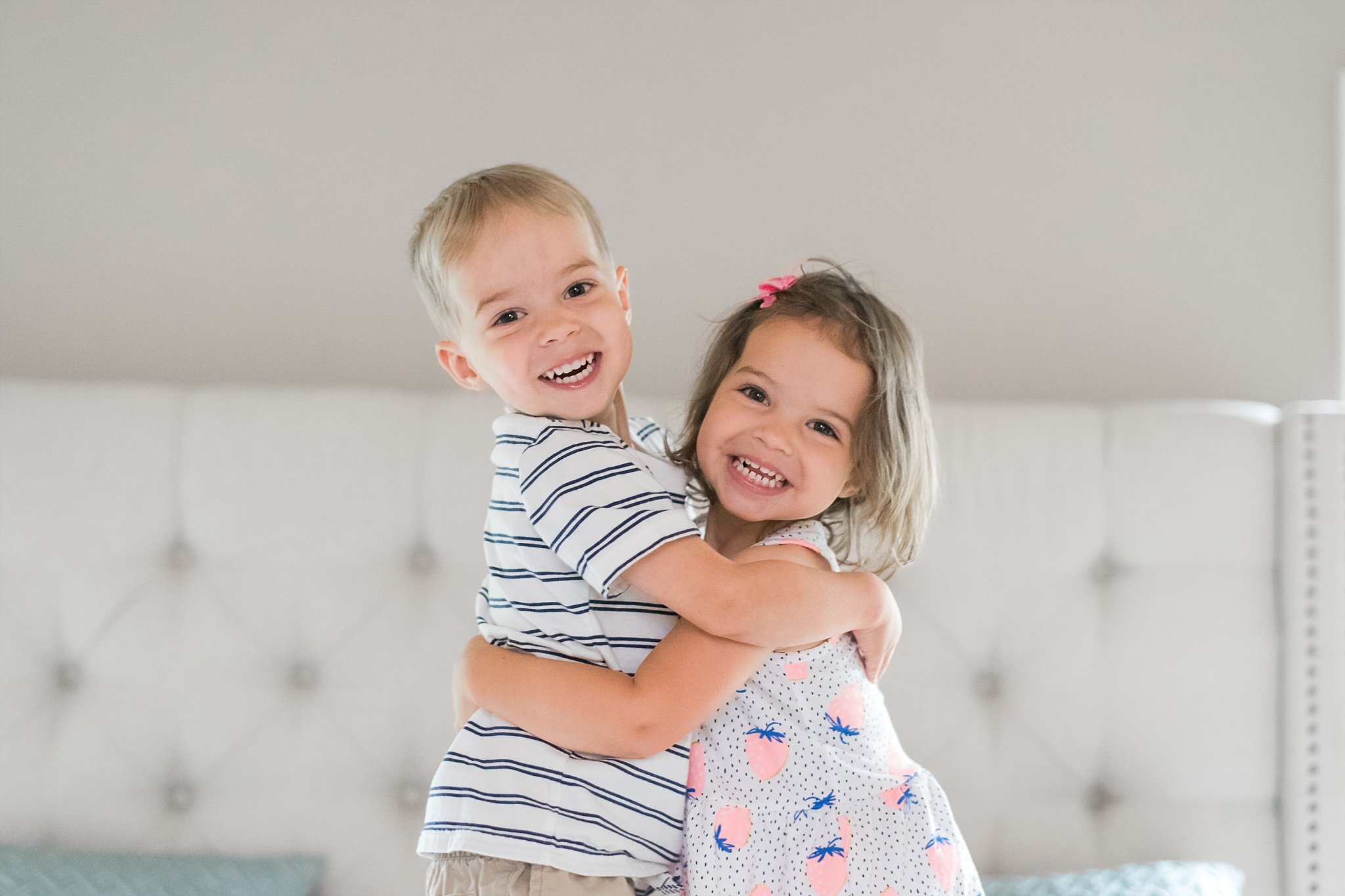 portrait of boy/girl twins hugging