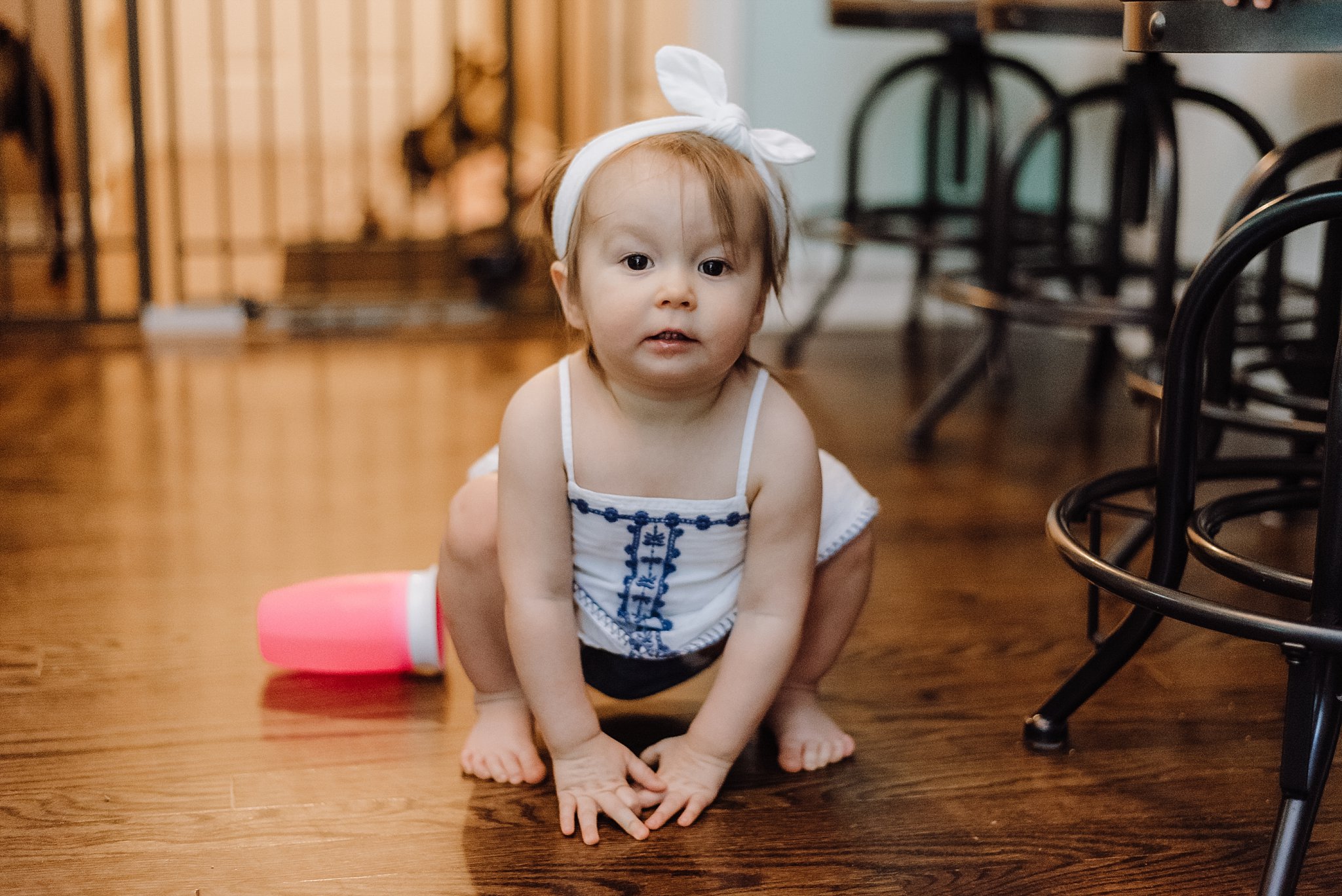 toddler girl squatting 