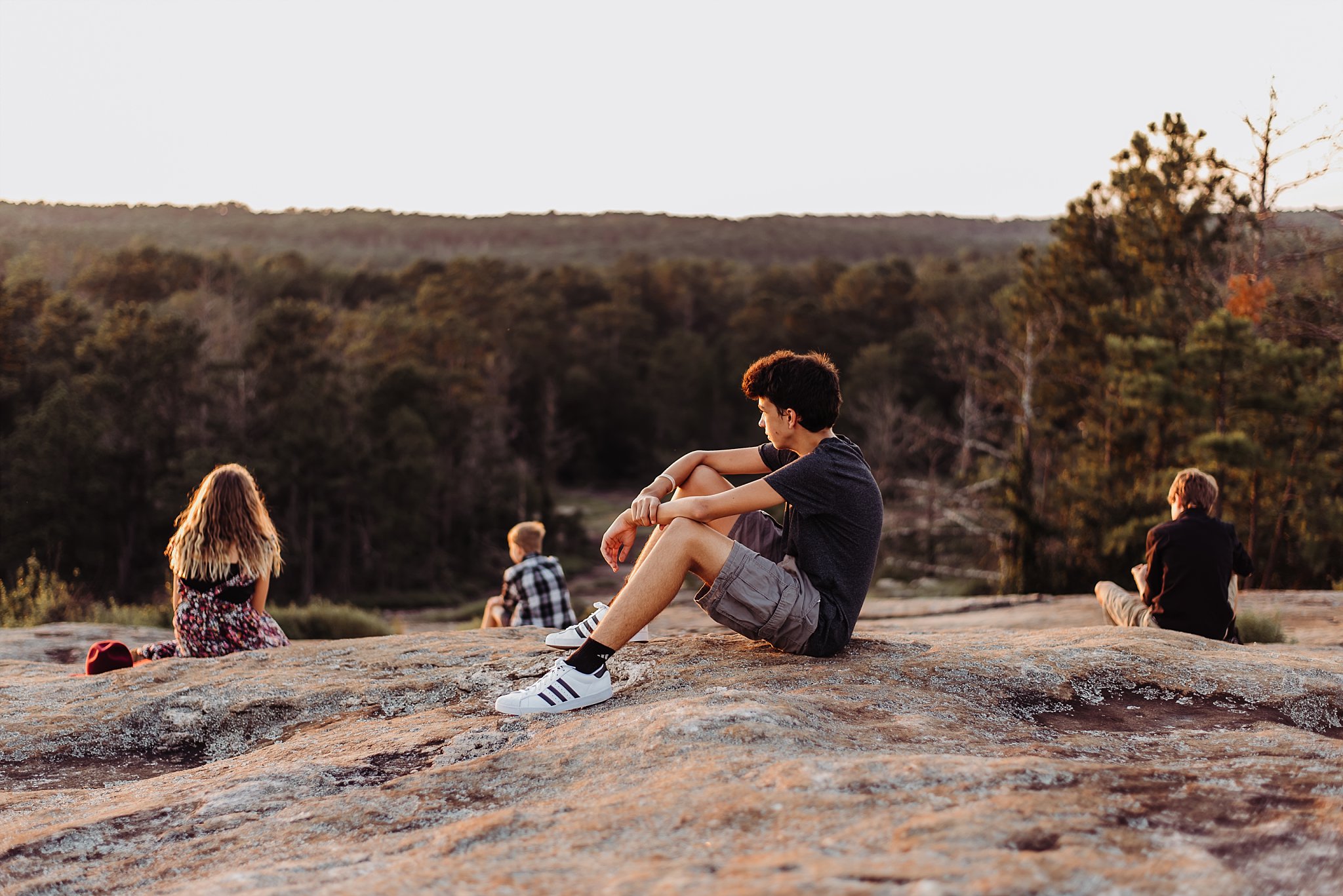 4 kids looking out at Arabia Mountain sunset