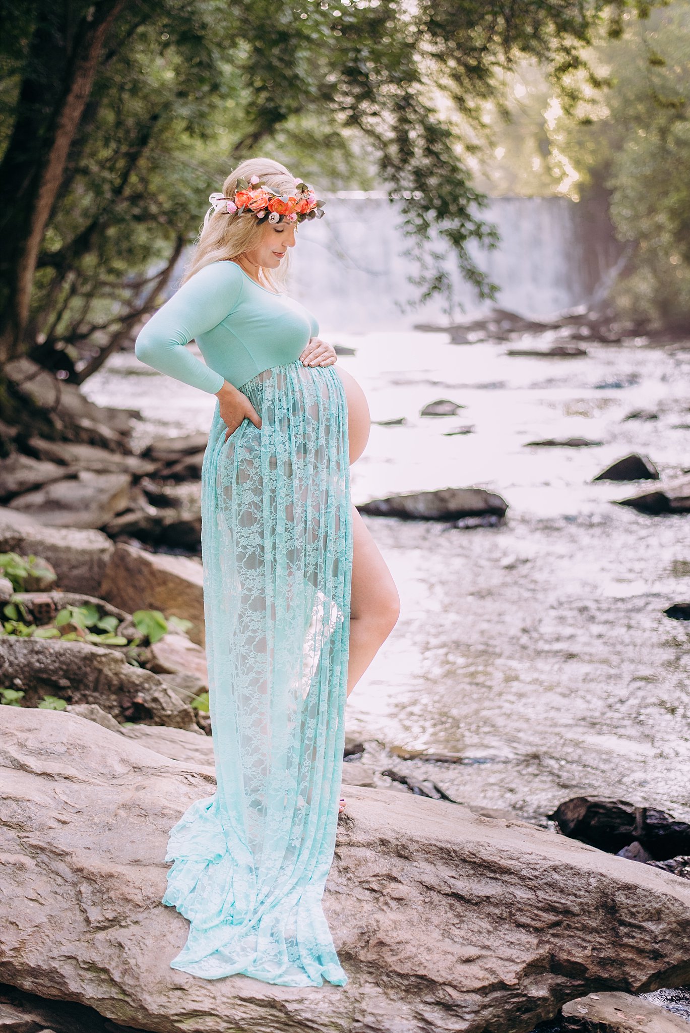 pregnant mom in sheer gown with flower crown at Roswell Mill Waterfall