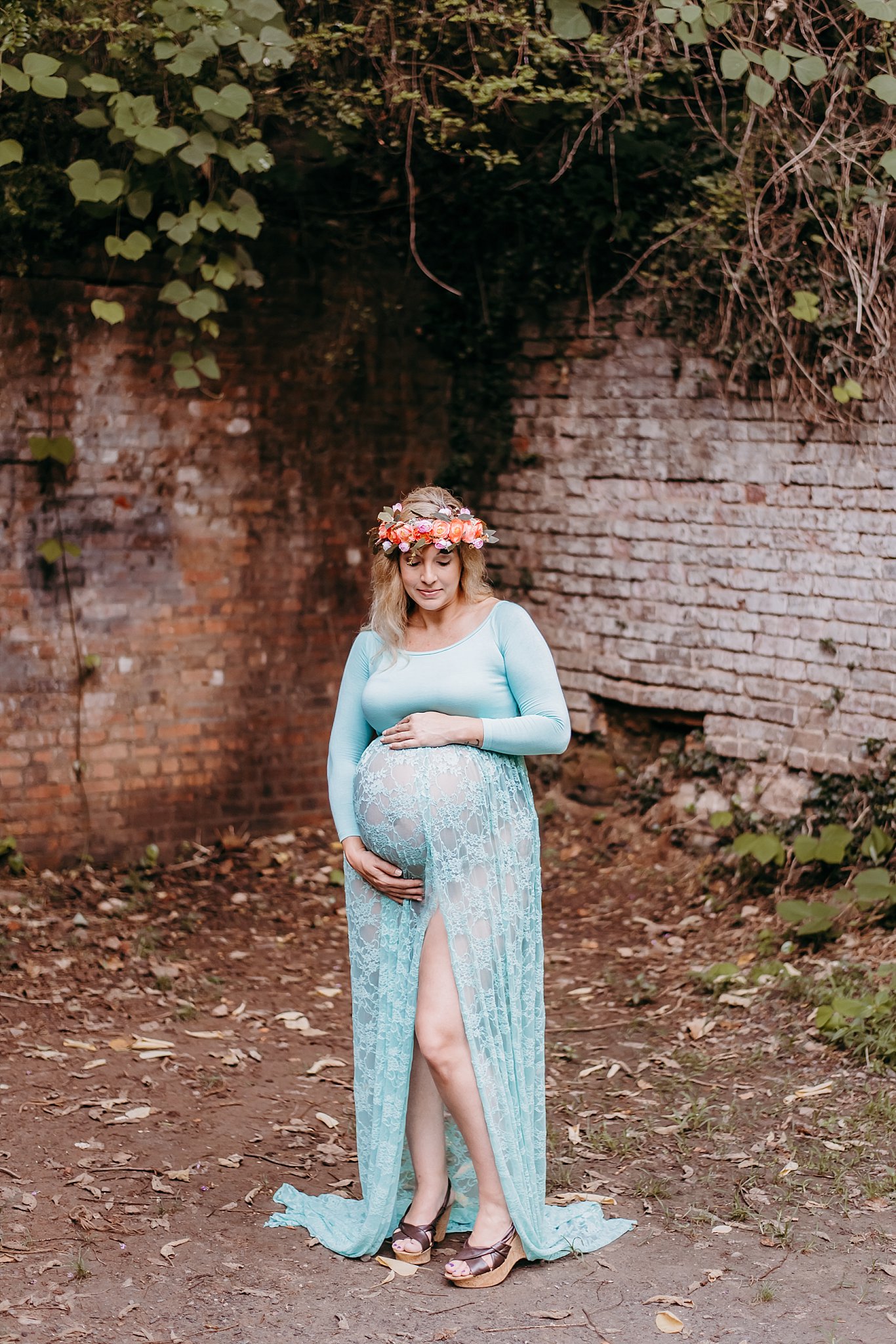 pregnant mom in sheer gown with flower crown at Roswell Mill ruins