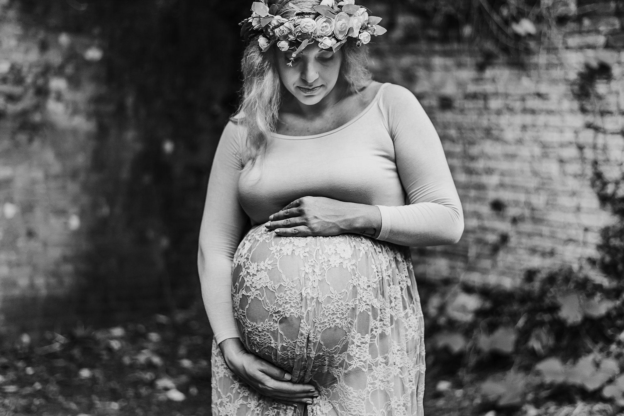 pregnant mom in sheer gown with flower crown at Roswell Mill ruins