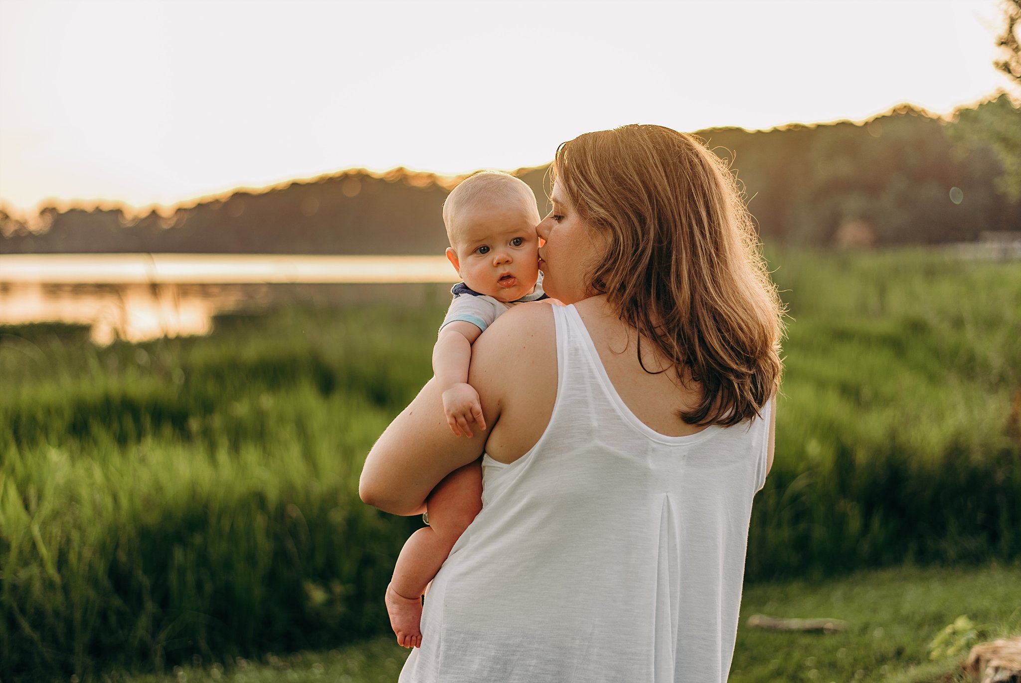 mother kissing baby Lake Acworth Cauble Park