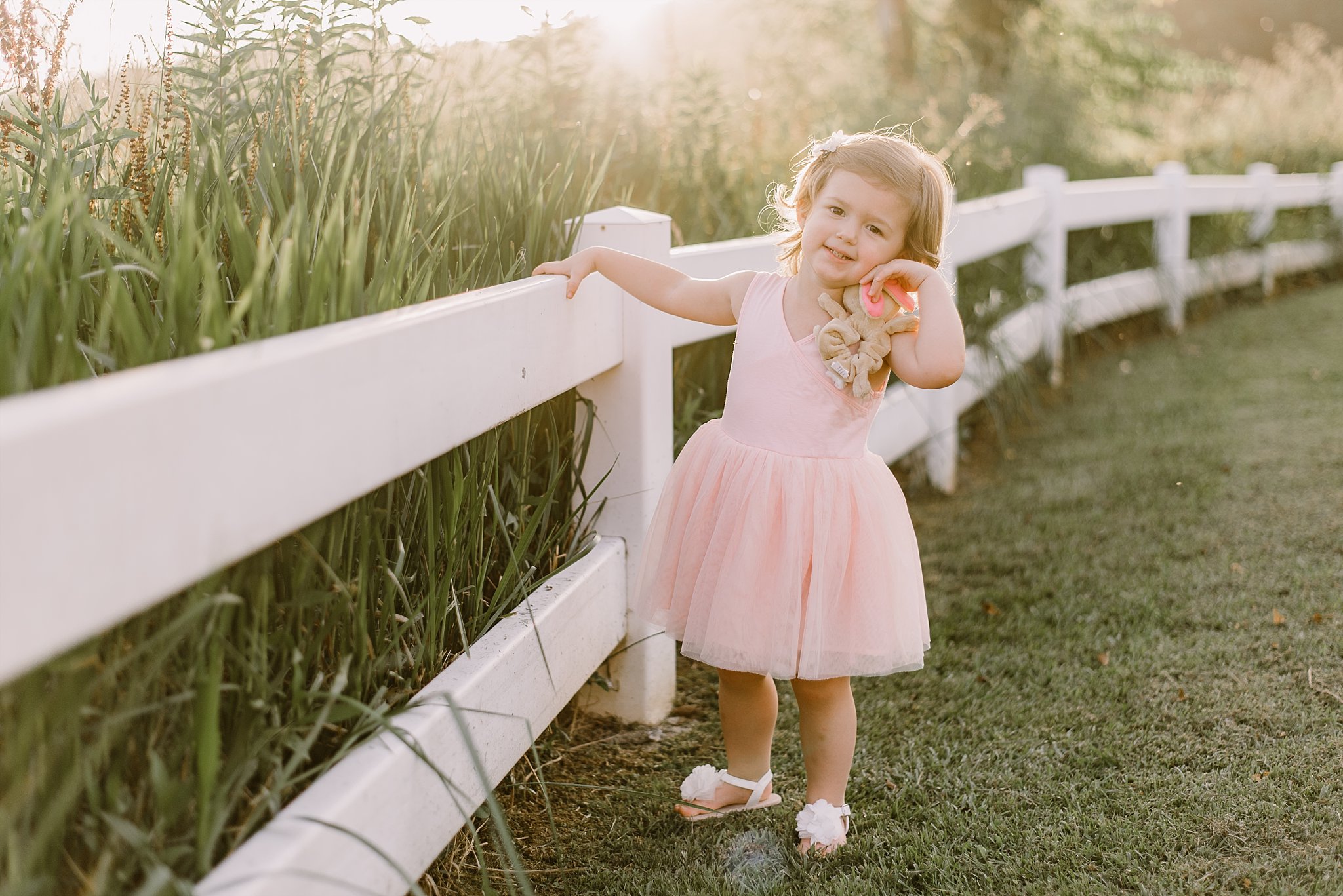 toddler girl in pink dress by white fence Cauble Park Lake Acworth