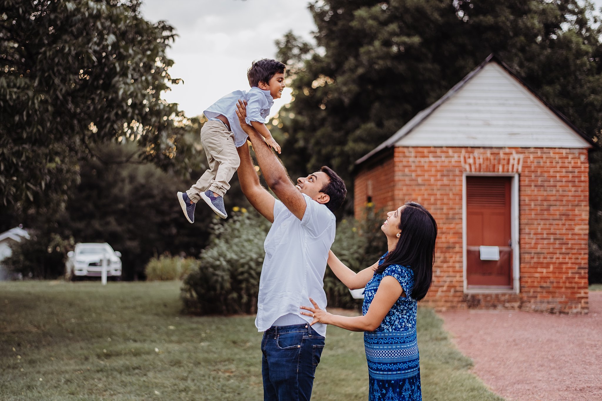 father throwing up toddler son up in air Barrington Hall Roswell, GA