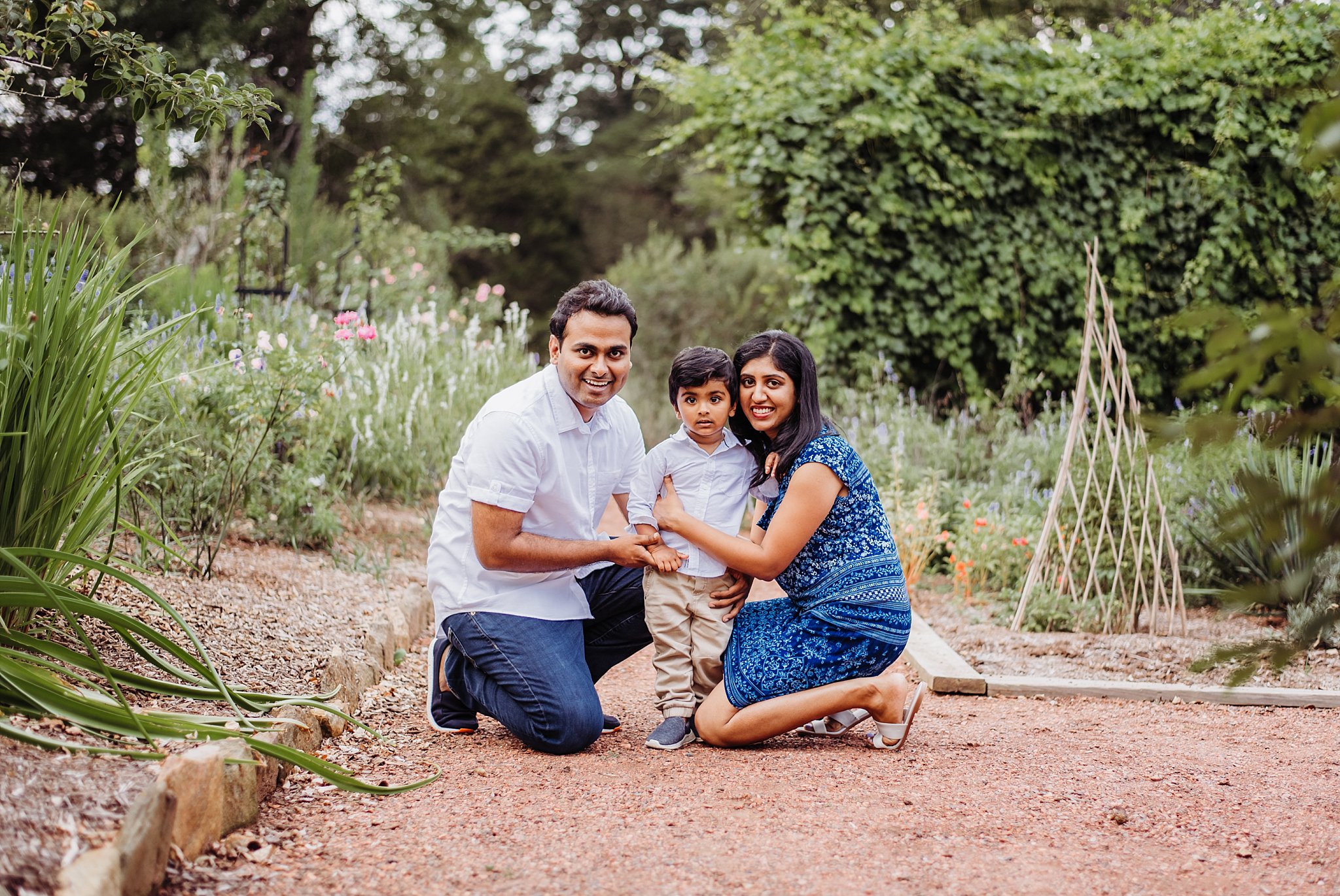 Family of 3 in gardens at Barrington Hall