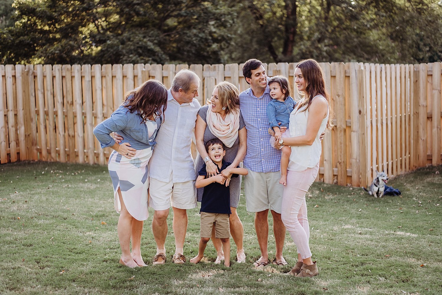 family laughing in backyard