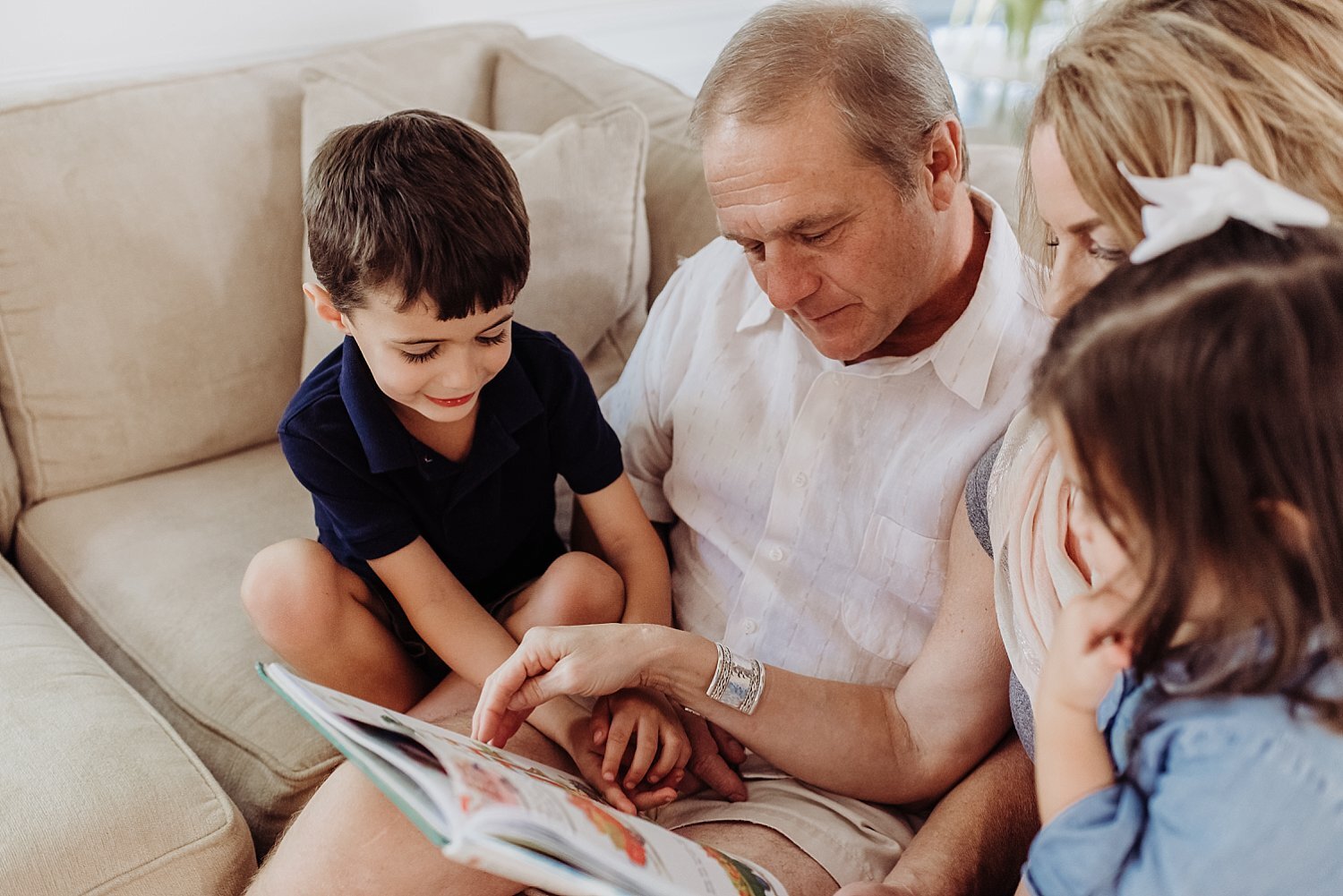 grandpa reading to grandson