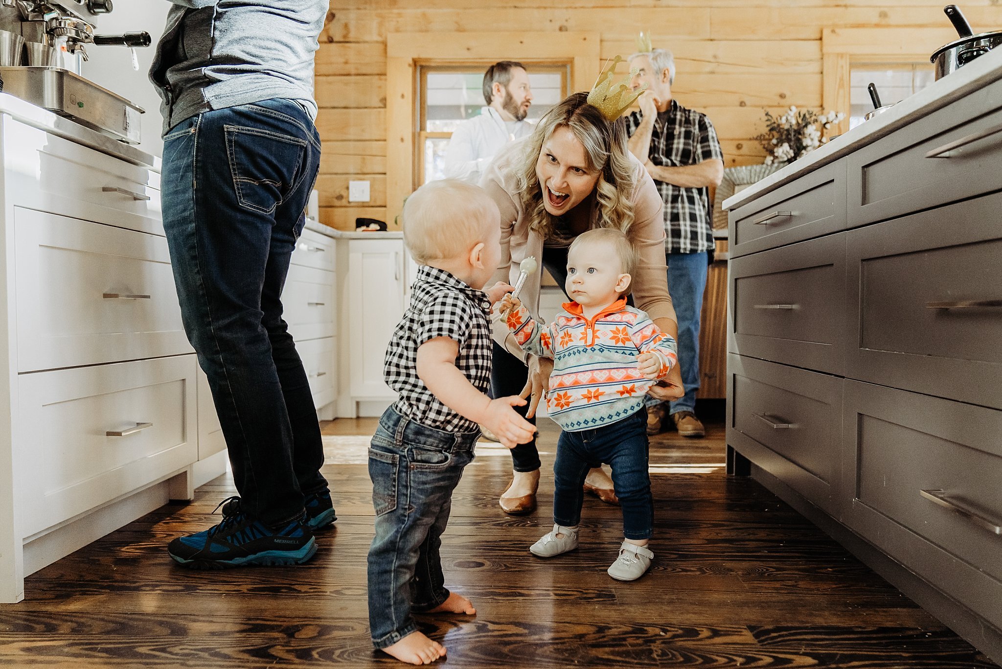 toddler on kitchen floor