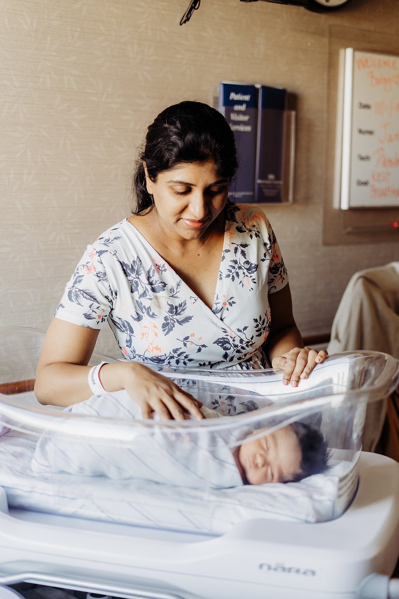 Family of four on hospital Mom standing over Newborn Bassinet | Atlanta Fresh 48 Newborn Hospital Photography