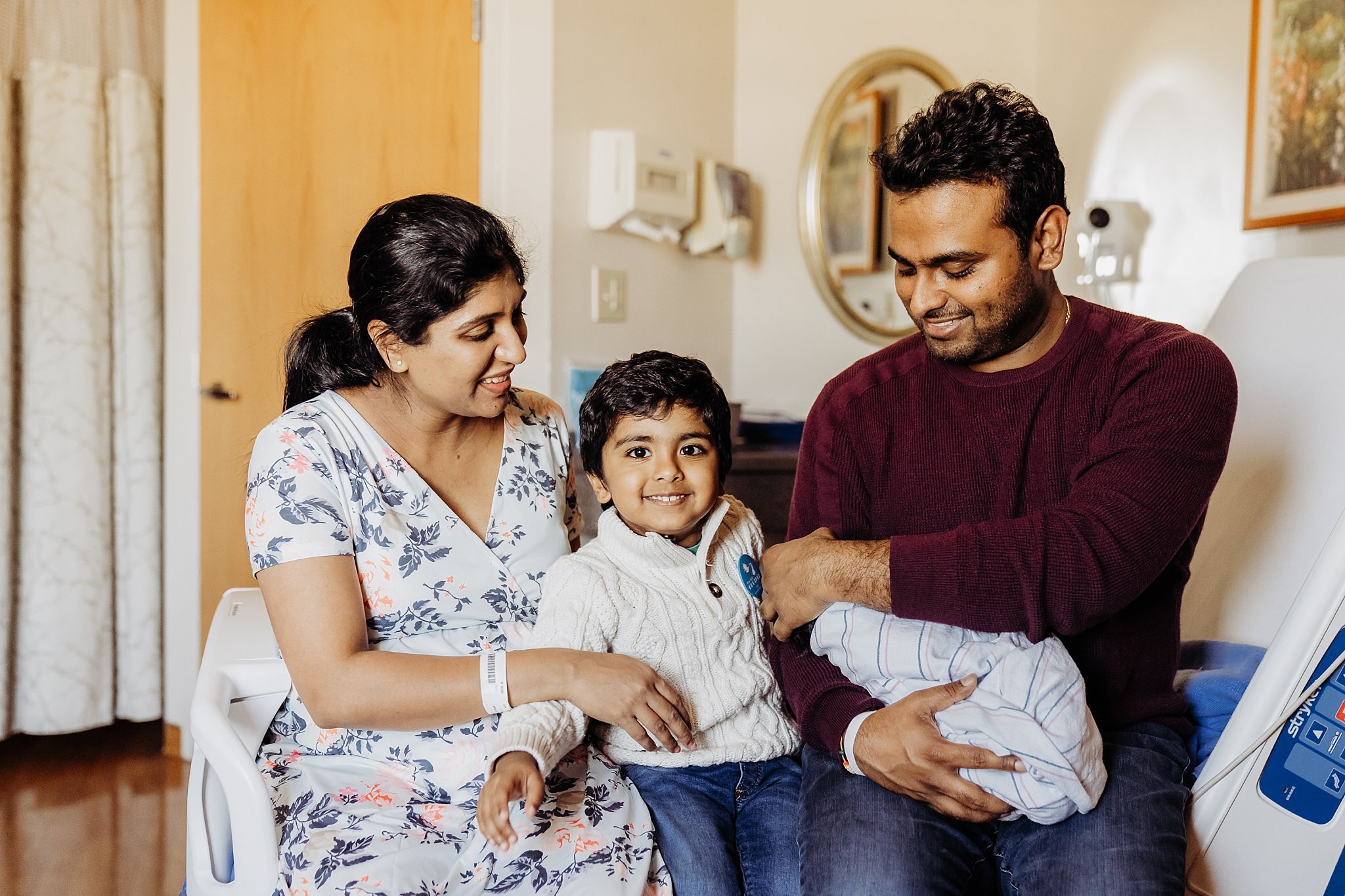 Family of four on hospital bed at Northside Atlanta Hospital | Atlanta Fresh 48 Newborn Hospital Photography