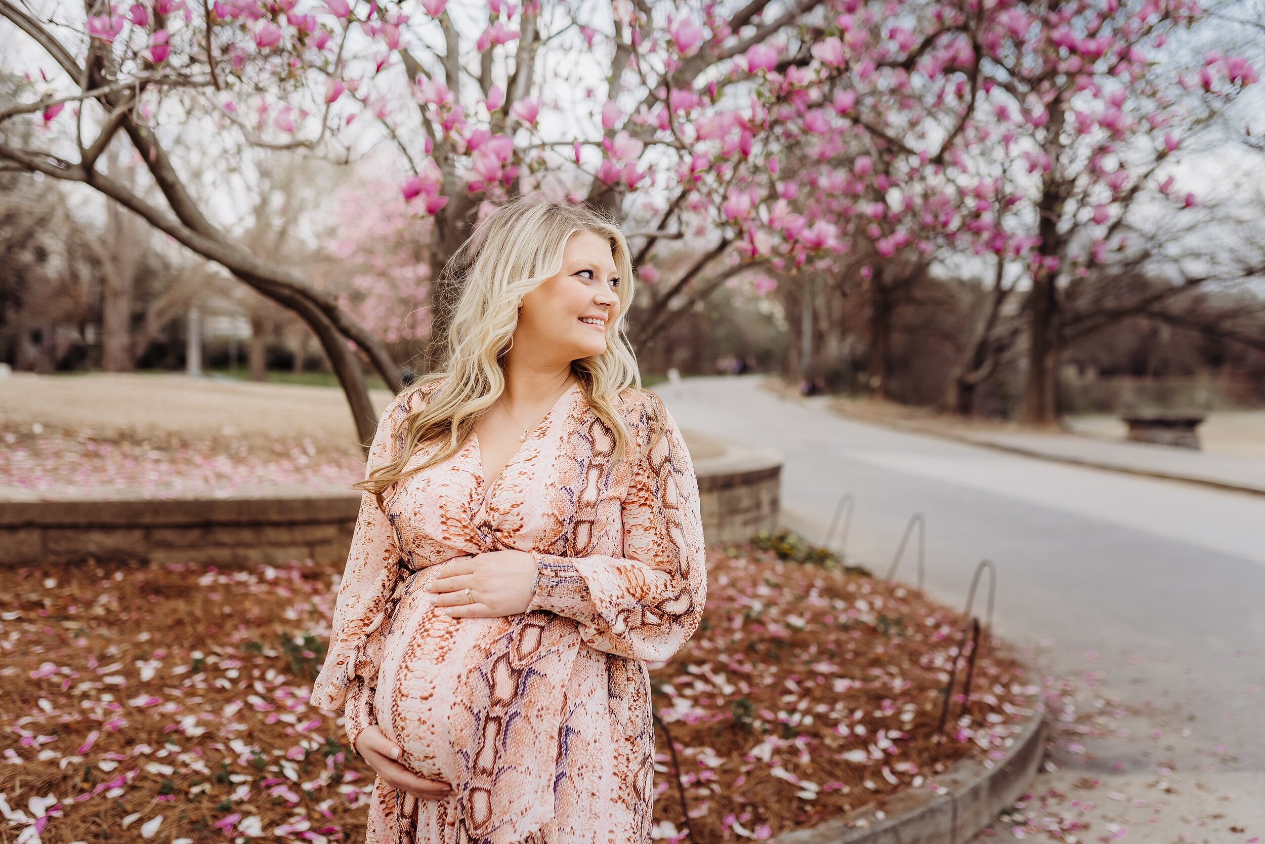 Pregnant mom in pink dress under Japanese Maple tree in Piedmont Park