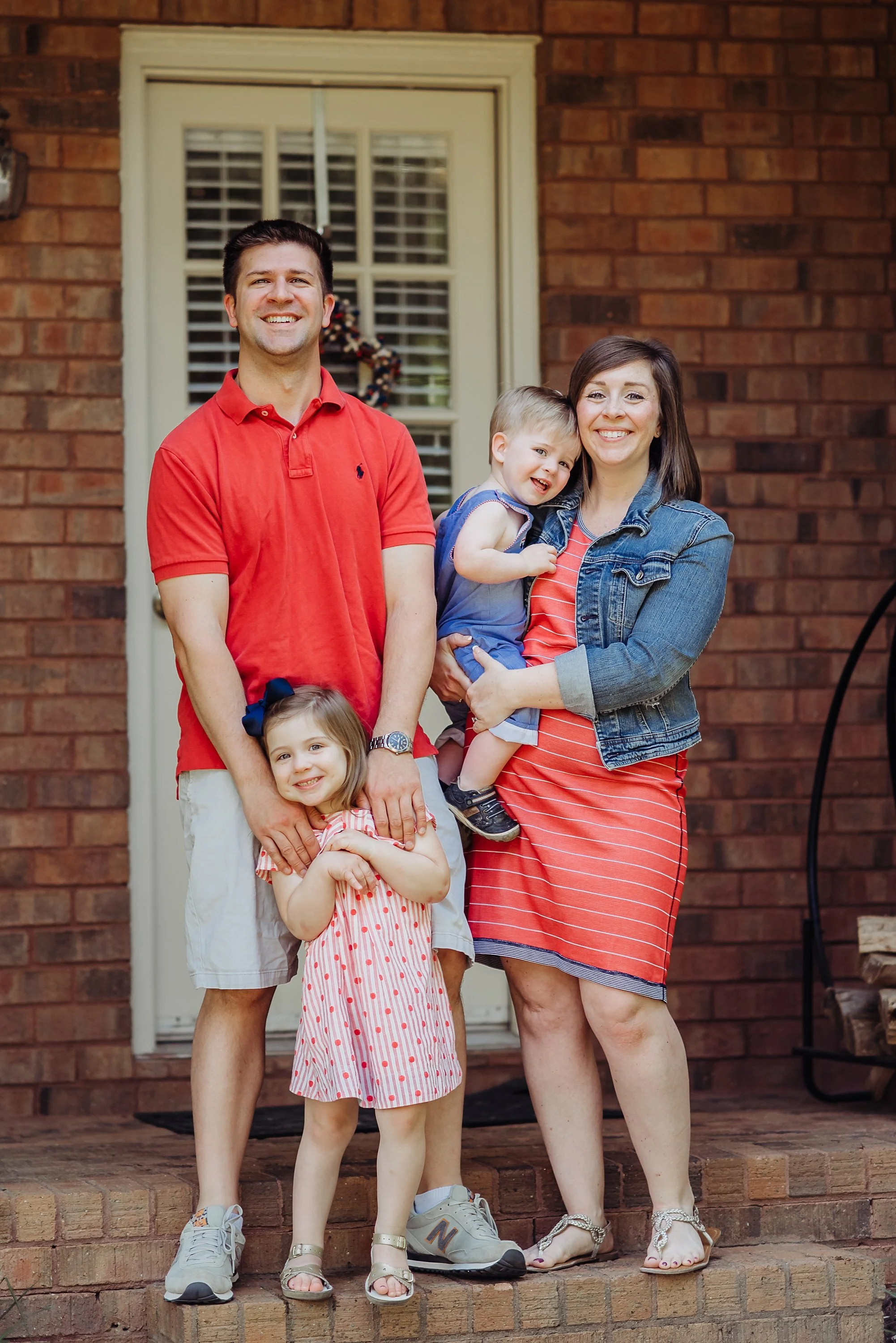 family of 4 on porch