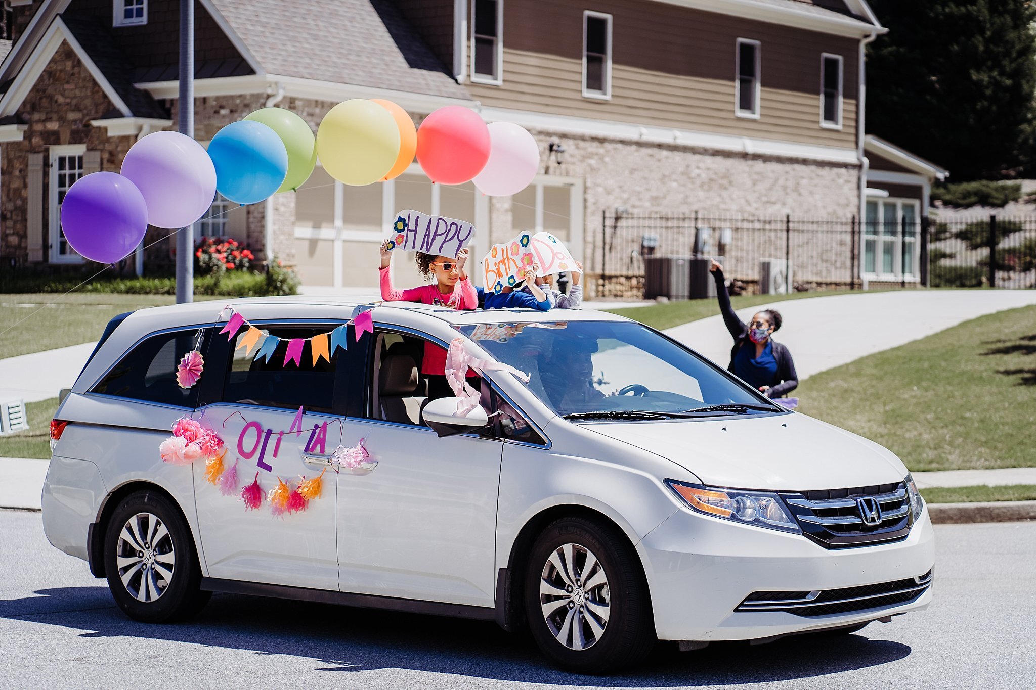 van decorated for birthday parade