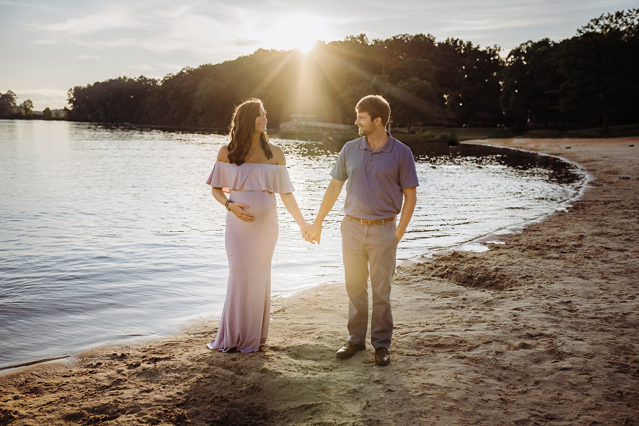 couple holding hands at beach at cauble park Atlanta Maternity Photography