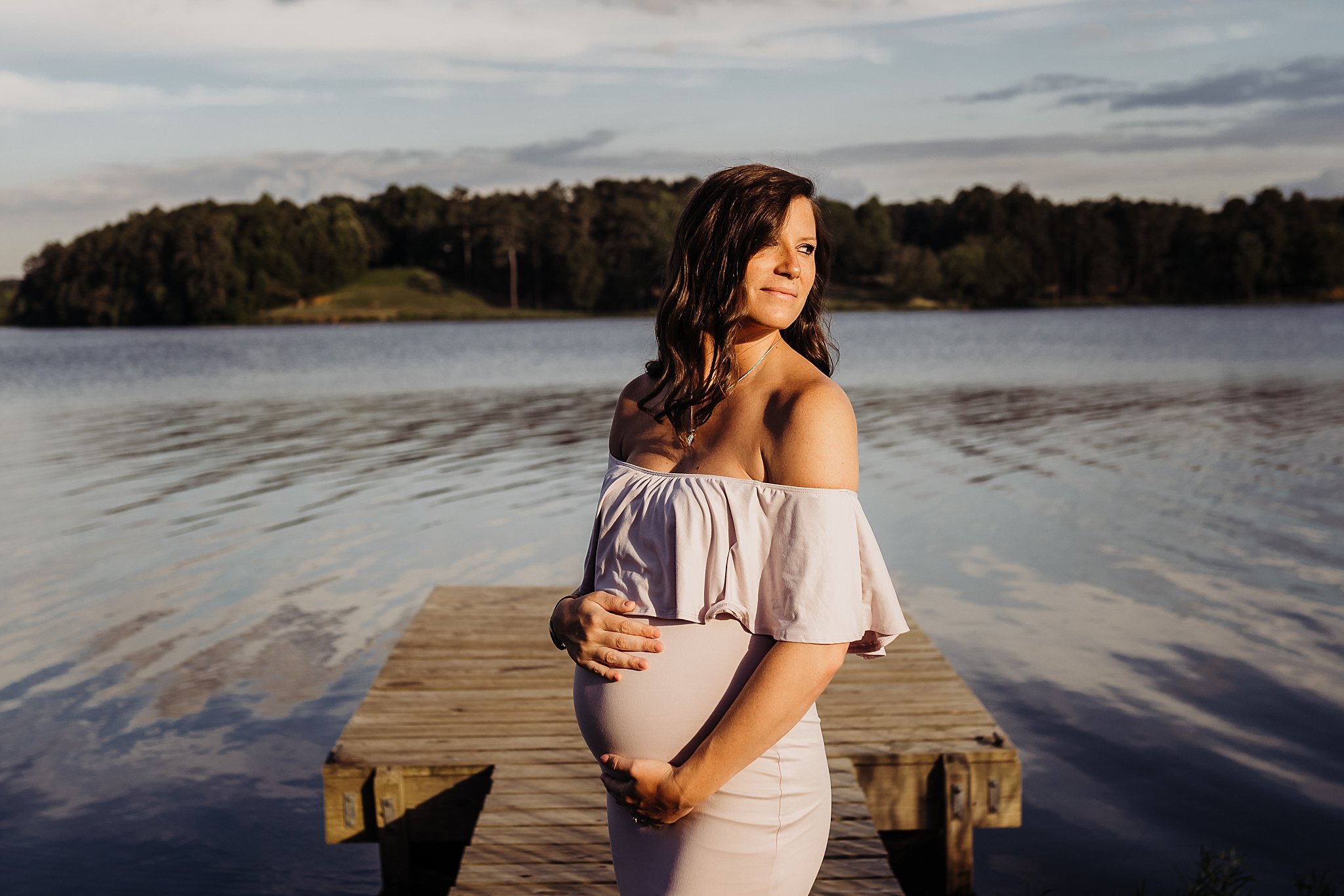 Pregnant mom in purple dress on dock at acworth lake | Atlanta Maternity Photographer