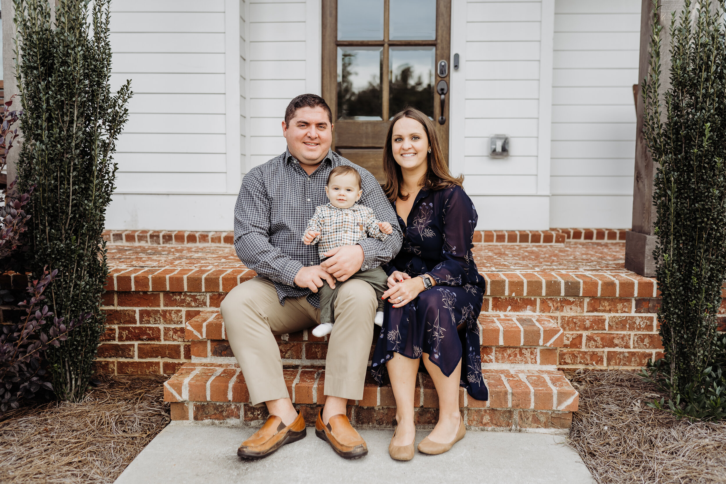 Cumming Family of 3 front porch photo session
