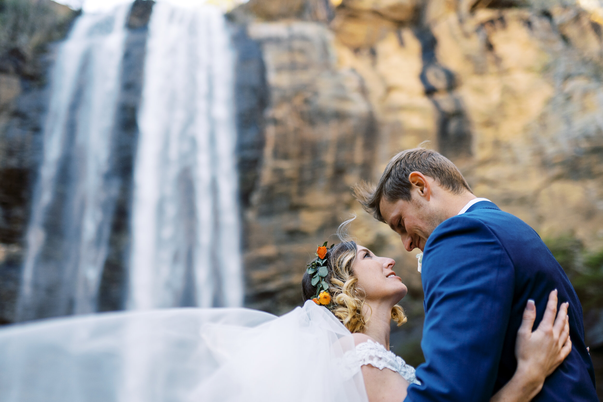 wedding couple under falls at Toccoa Falls in North Georgia Wedding