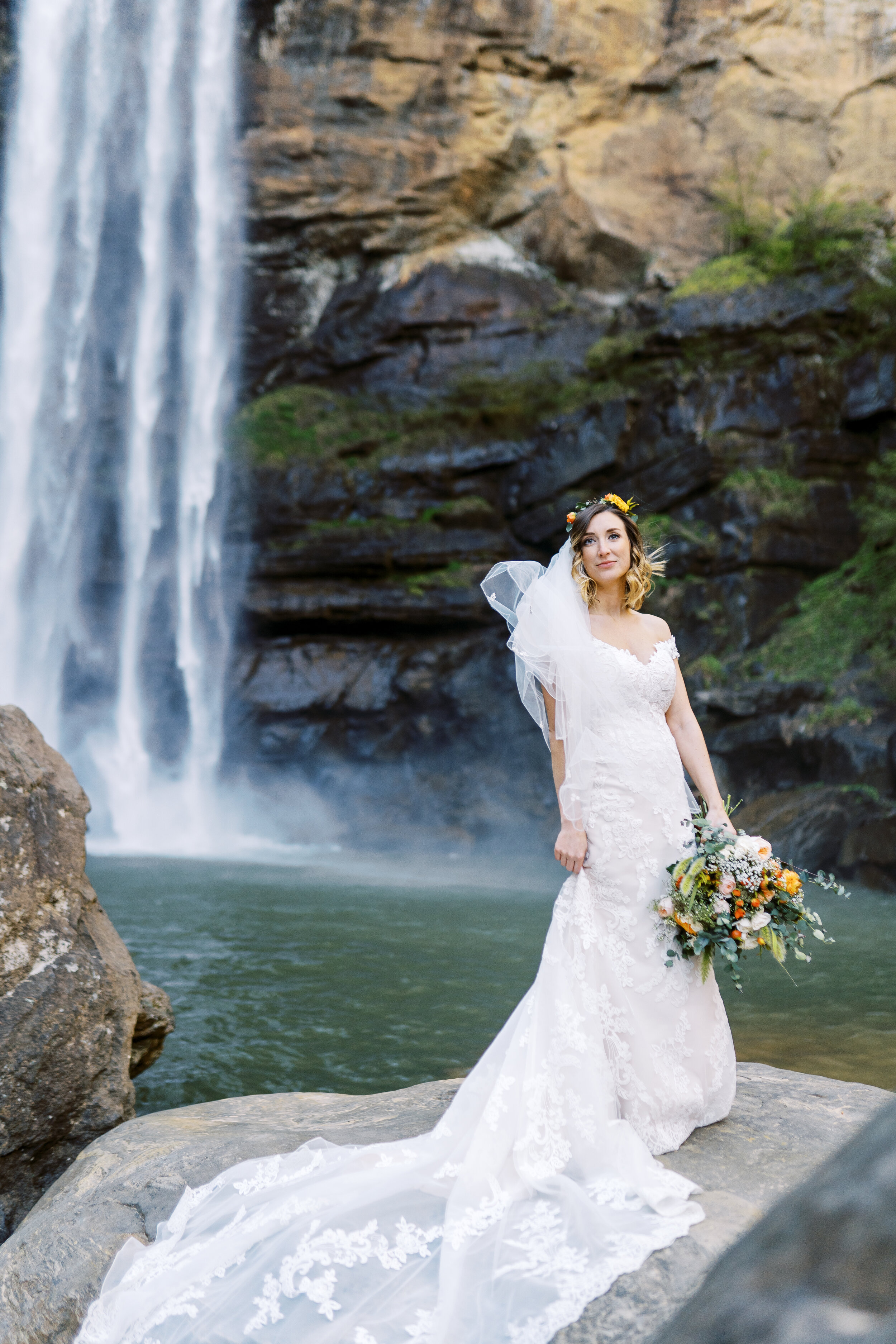 Bride under falls at Toccoa Falls in North Georgia Wedding